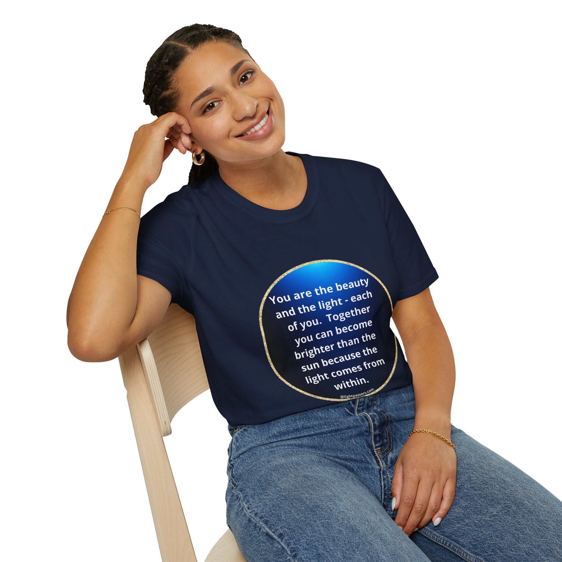 A smiling woman in a blue shirt sits on a chair, showcasing the Beauty Navy Circle Unisex T-shirt. The tee offers comfort with no side seams and durable shoulders, perfect for personalized designs.