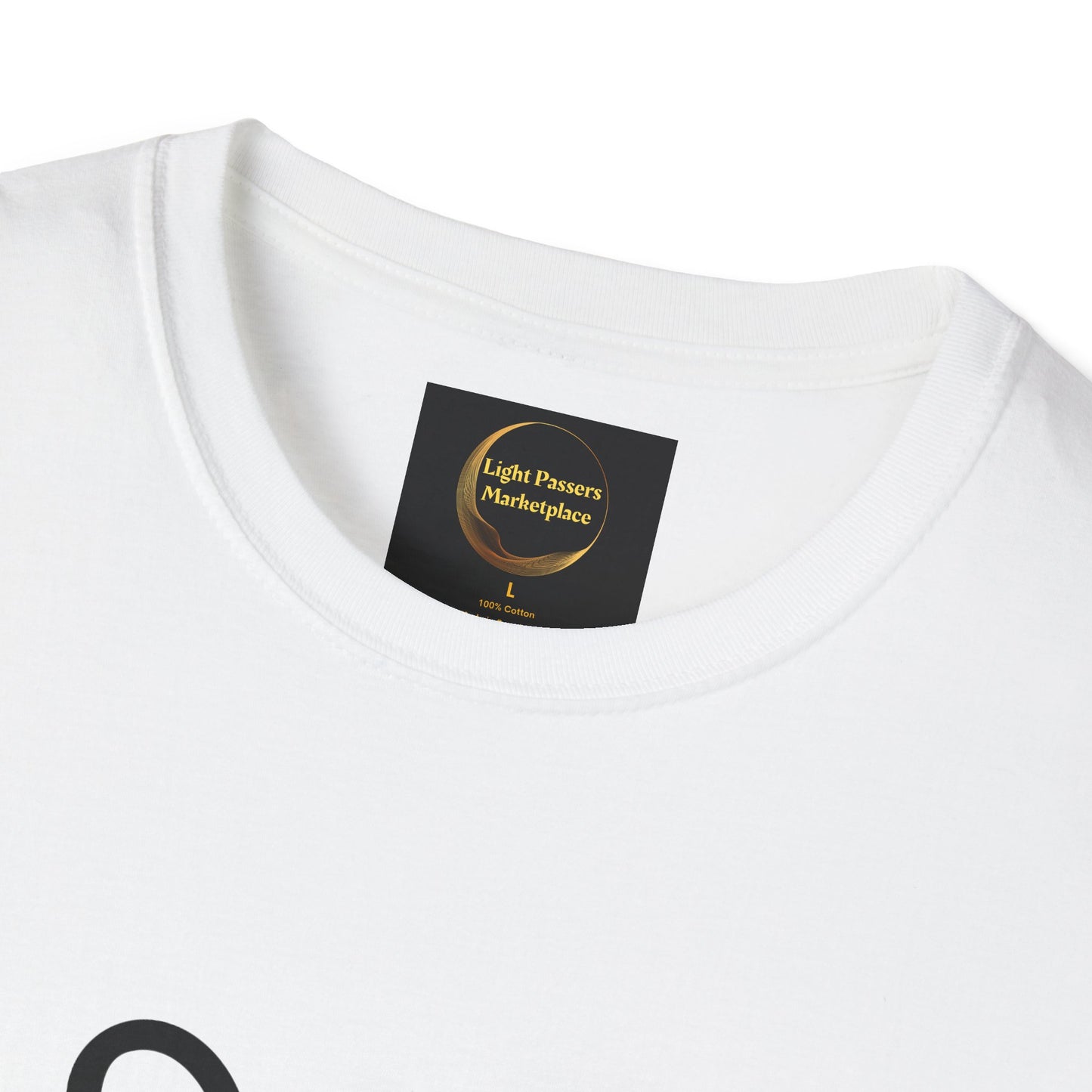 Close-up of the Soccer Dog Unisex T-Shirt, featuring a black Light Passers Marketplace label on the collar, indicating size L and 100% cotton material.