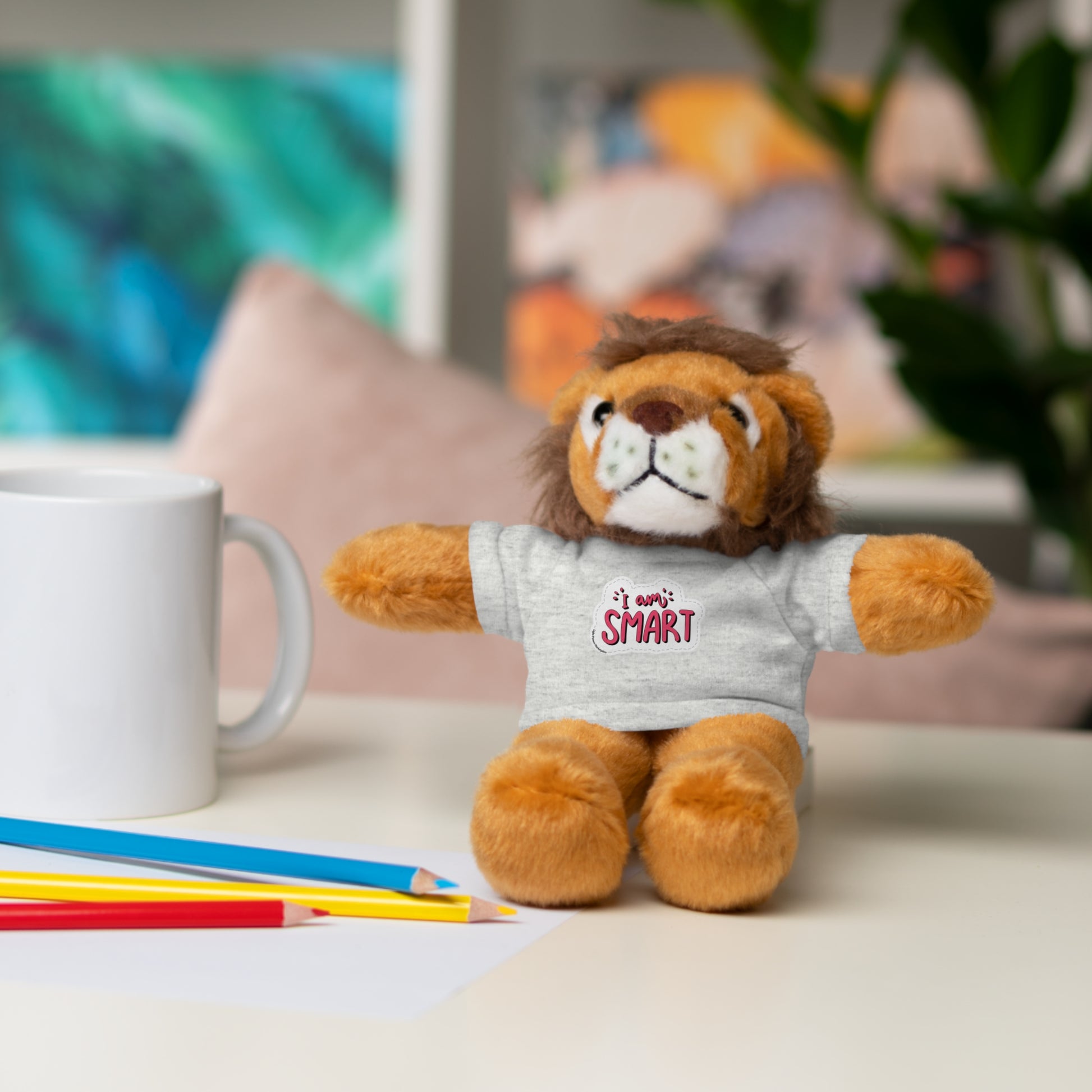 Stuffed lion toy wearing a removable T-shirt with 'I am Smart' message, part of Cool Stuff Stuffies collection featuring six different animals.