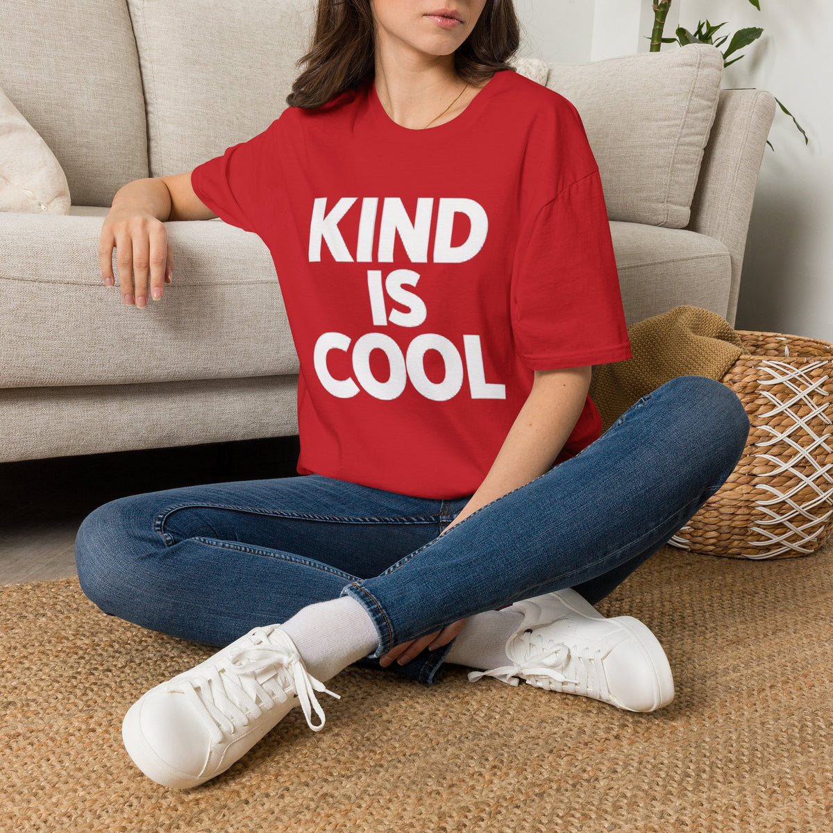 Red unisex T-shirt with bold text graphic reading “KIND IS COOL”