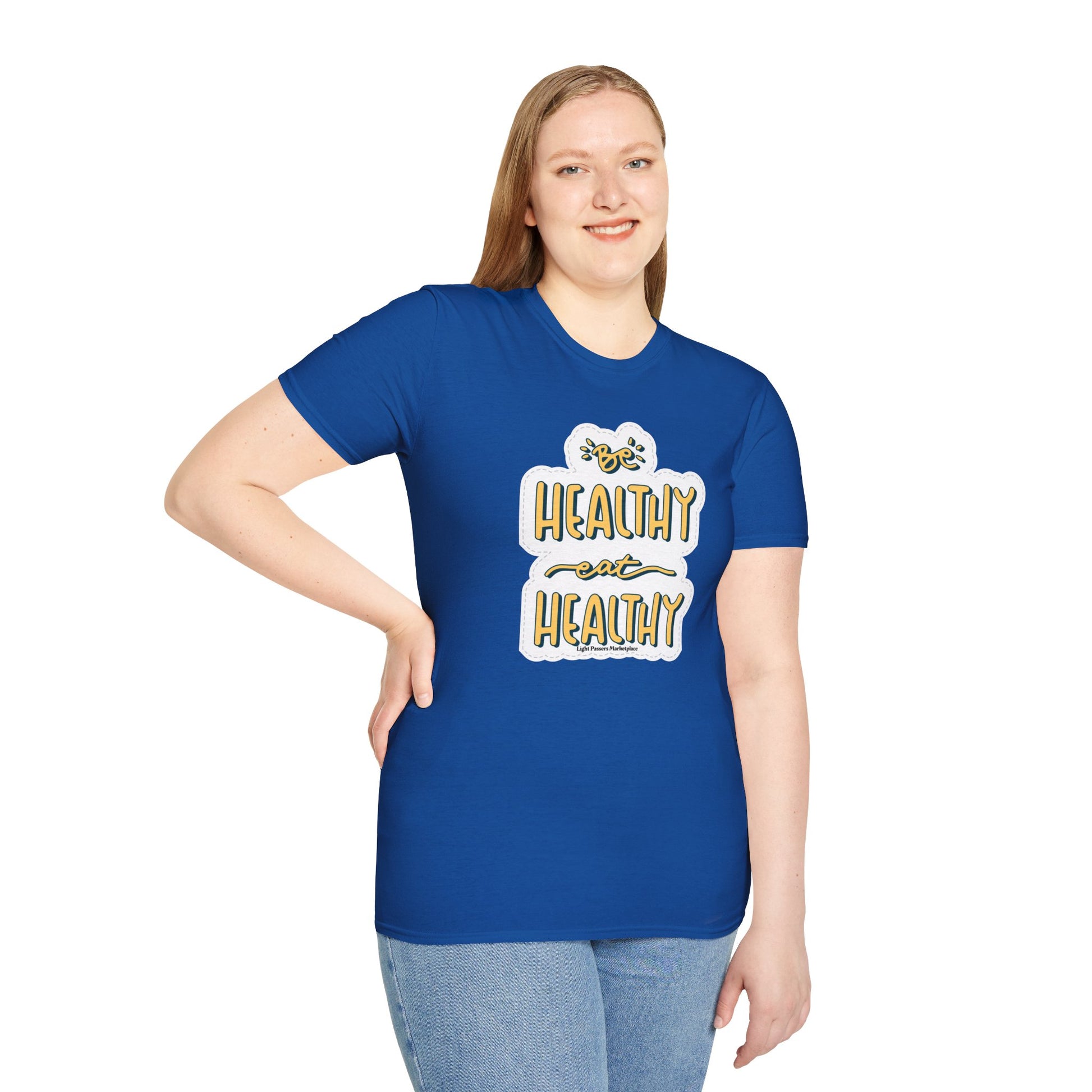 A woman in a blue shirt smiles, showcasing the Be Healthy Eat Healthy Unisex T-Shirt. Soft 100% cotton tee with twill tape shoulders and ribbed collar. No side seams for enhanced comfort.