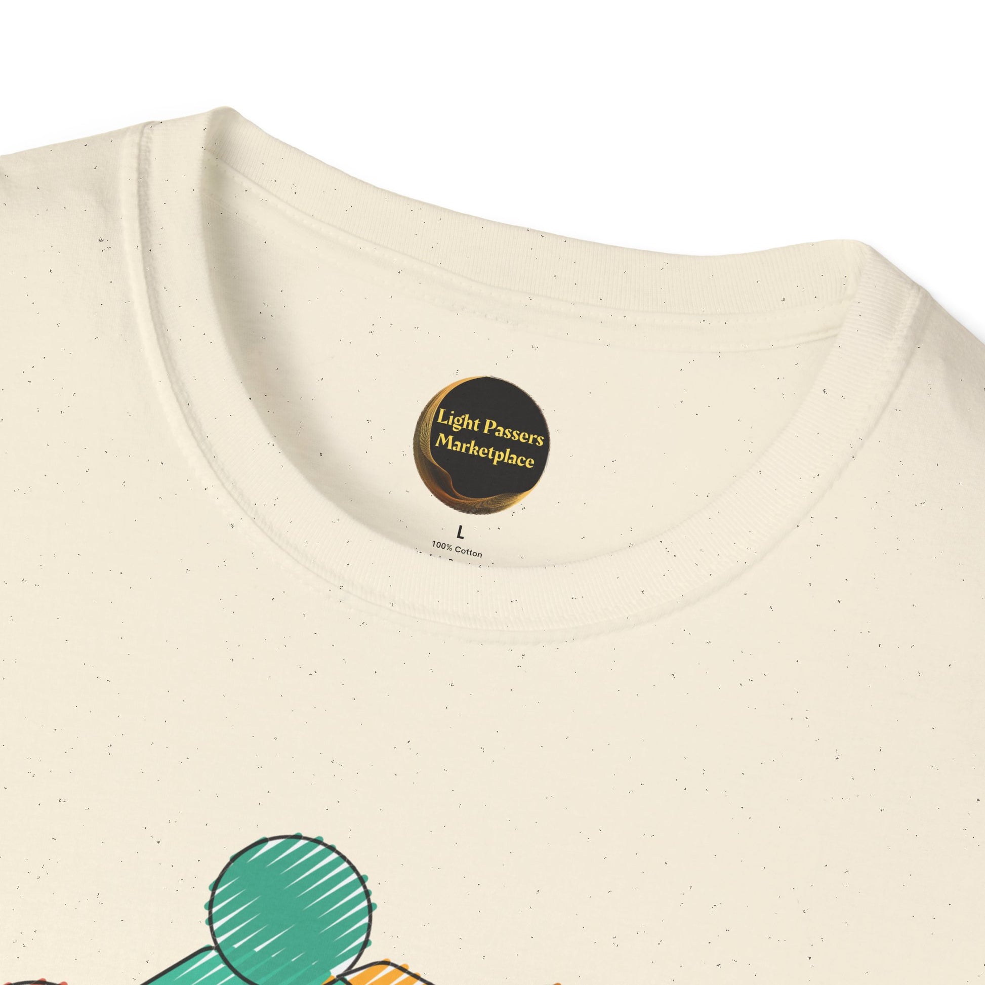 Close-up of the Teams Love and Peace Change Makers Unite T-shirt collar, featuring a “Light Passers Marketplace” print below the light-cream ribbed crew neck.