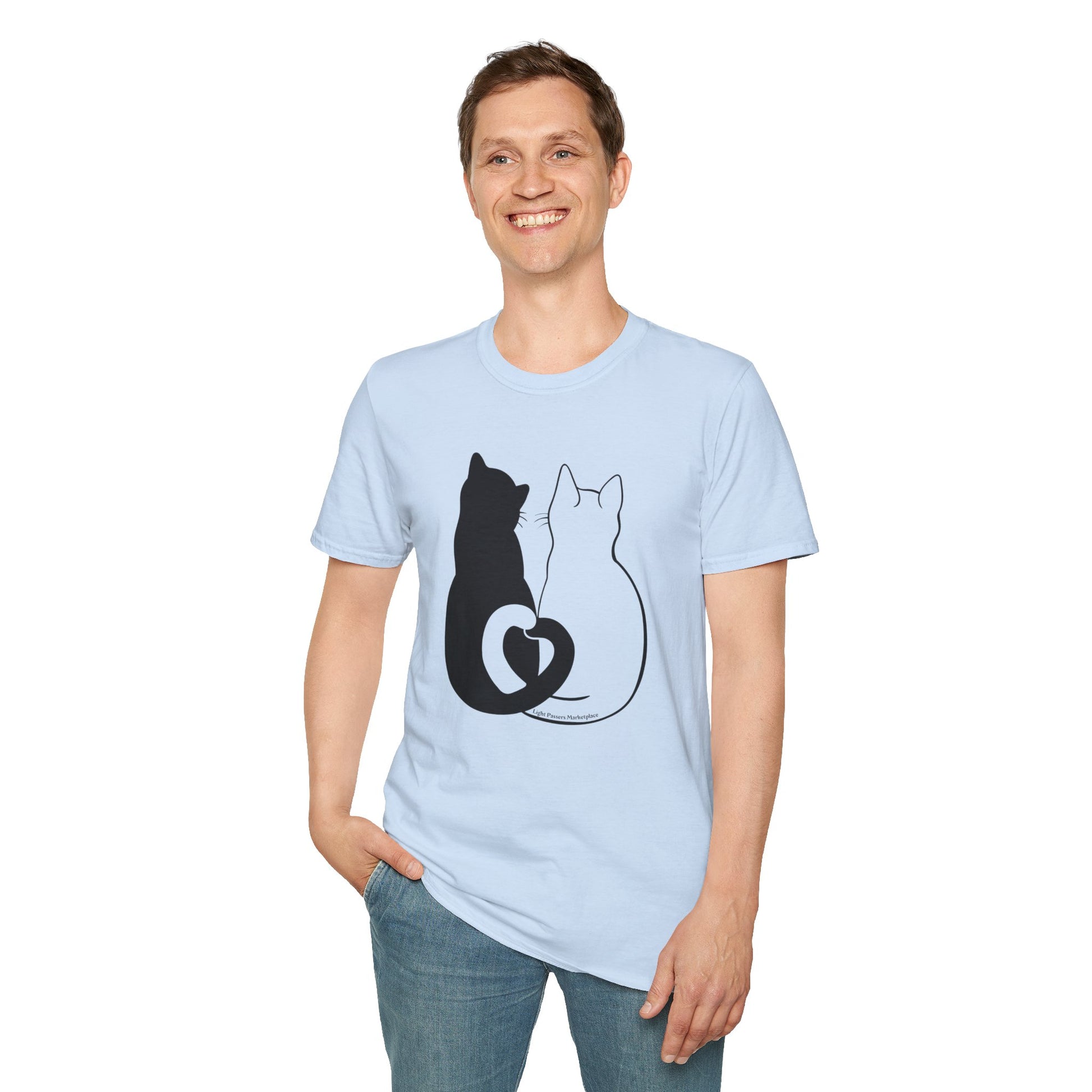 A man in a Cats in Love Unisex T-Shirt, smiling, showcasing the cat design. Made of soft 100% cotton, twill tape shoulders, no side seams, and ribbed collar. Ethically sourced US cotton.