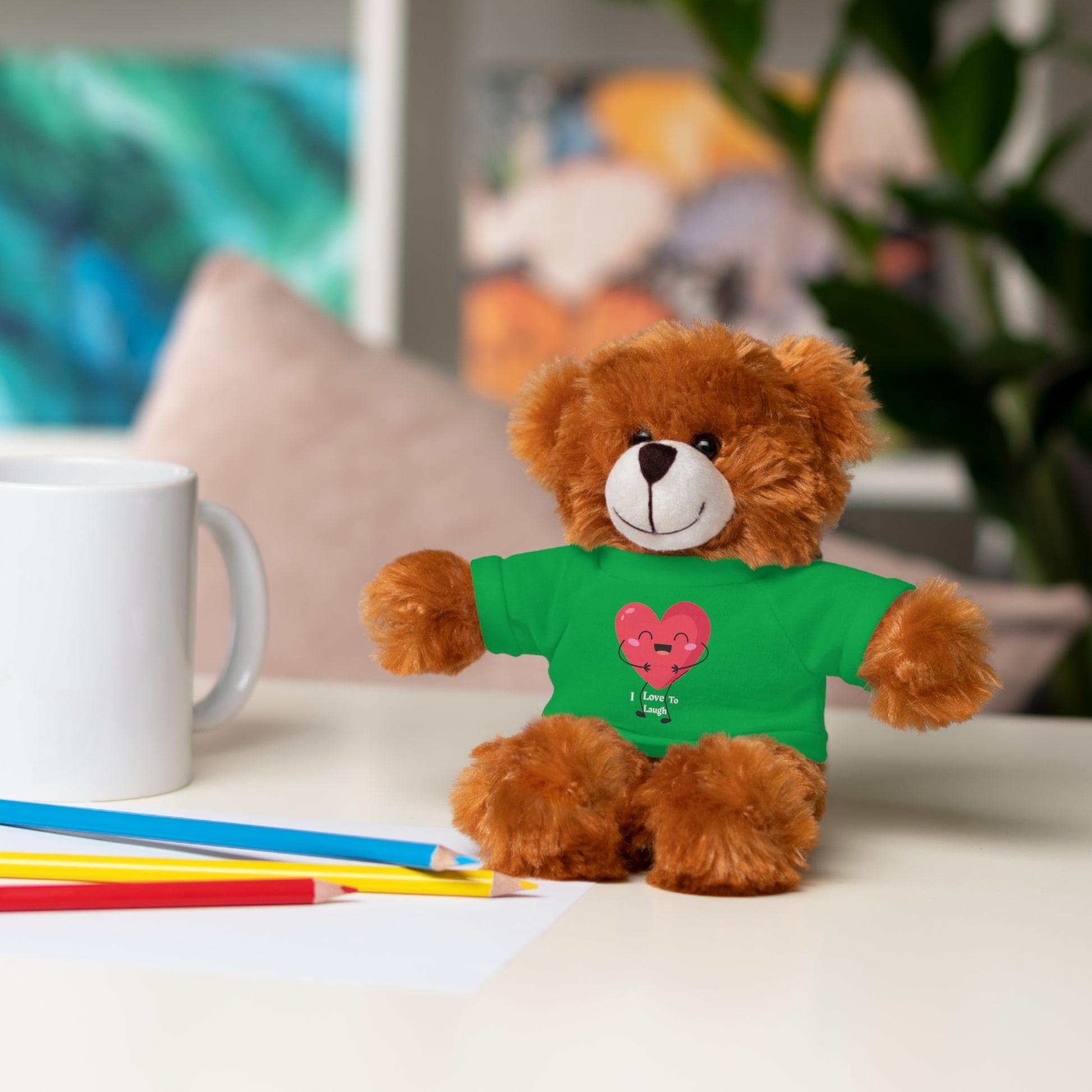 Cool Stuff Stuffies Choice of 6 Animals I Love to Laugh Heart Removable T-shirt features a plush teddy bear with a customizable green shirt, perfect for gifting.