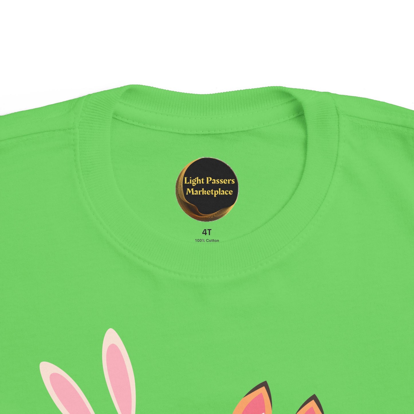 The Light Never Stop Reading Toddler Tee features bright lime-green cotton, showcasing two playful animal ears, embodying storybook adventure and inspirational reading themes.