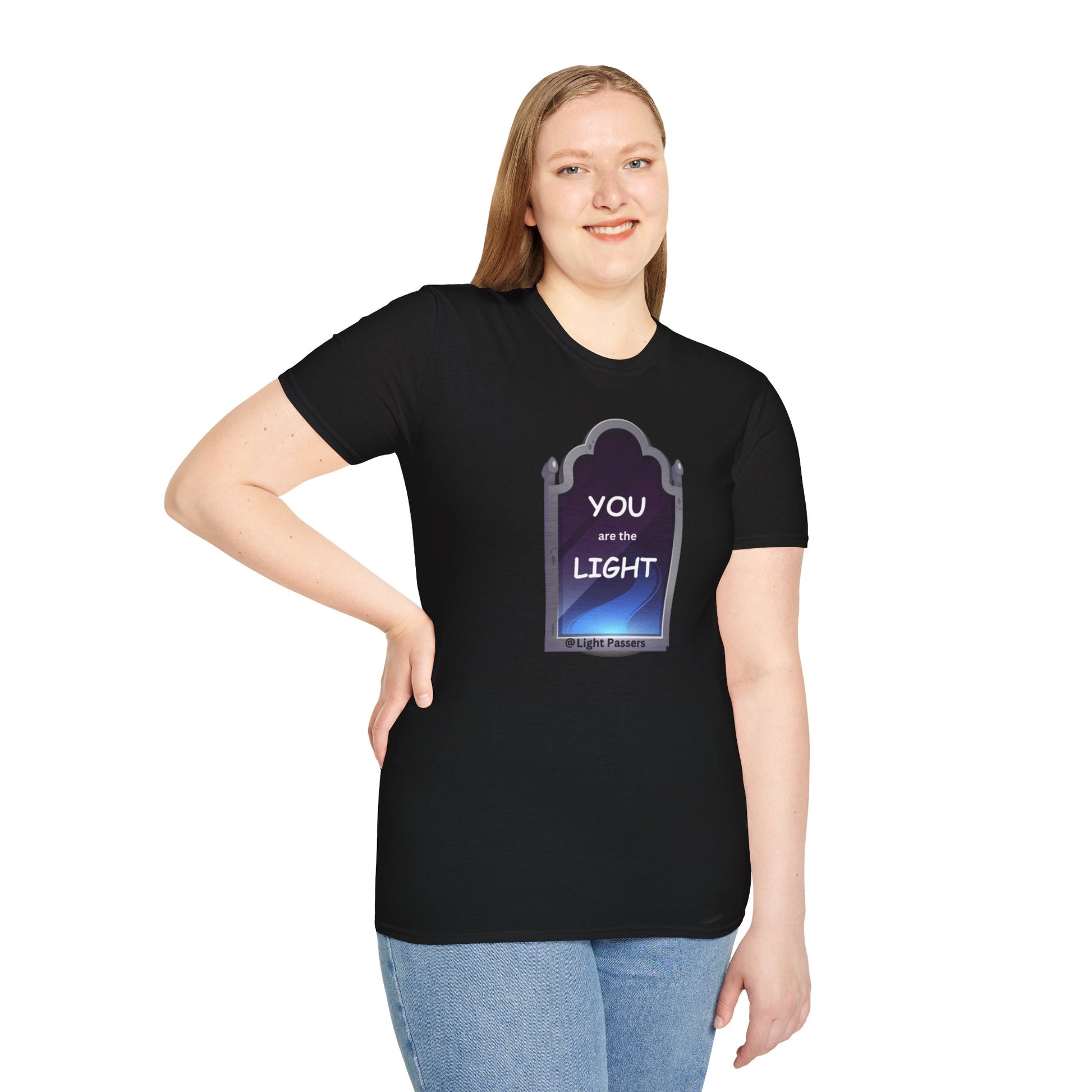 A woman in a black shirt smiles, posing for a picture in the Light Mirror Unisex T-shirt. Close-up of jeans visible. Casual, 100% cotton tee with no side seams for comfort.