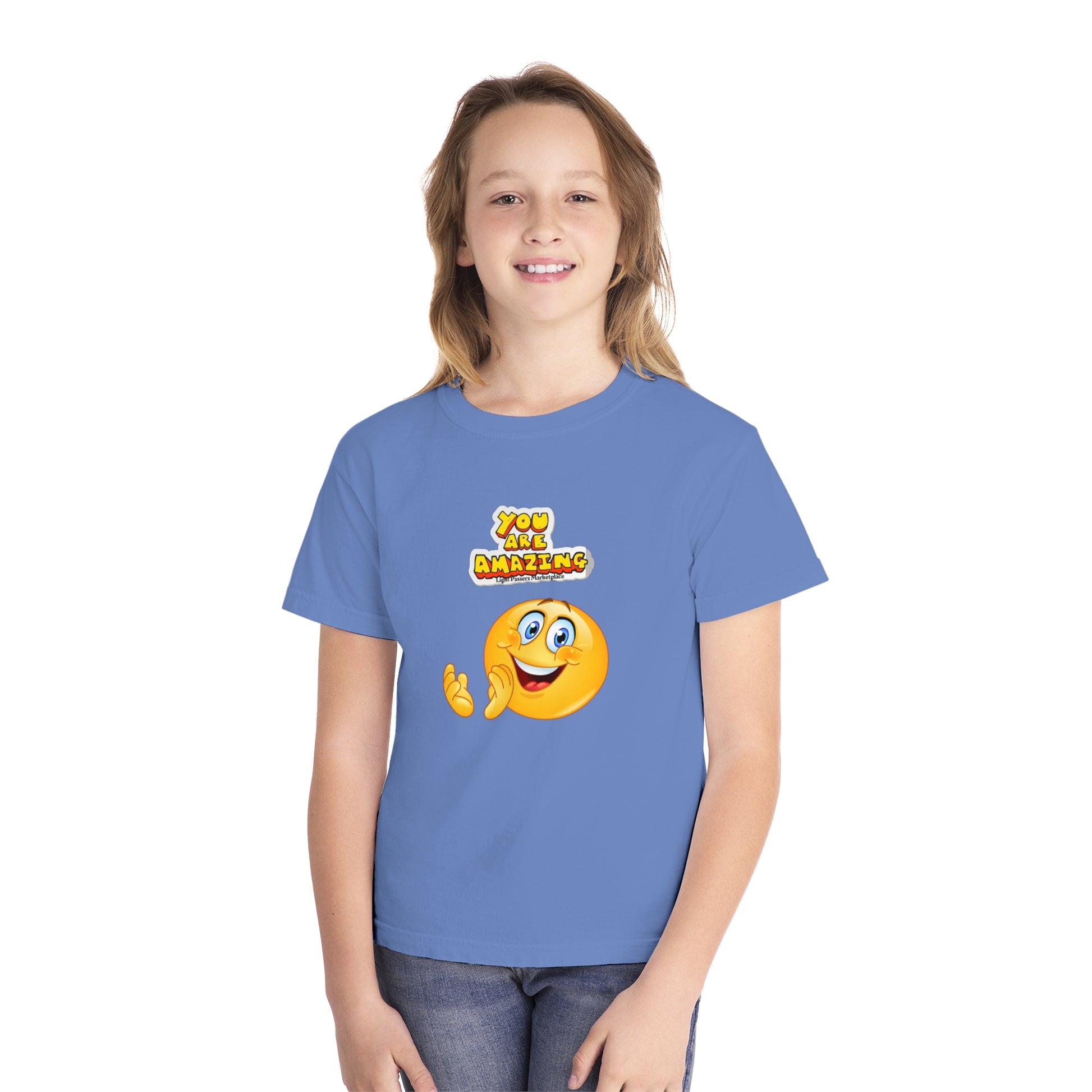 A youth t-shirt featuring a girl in a blue shirt, embodying comfort and agility. Made of 100% combed ring-spun cotton for all-day wear.