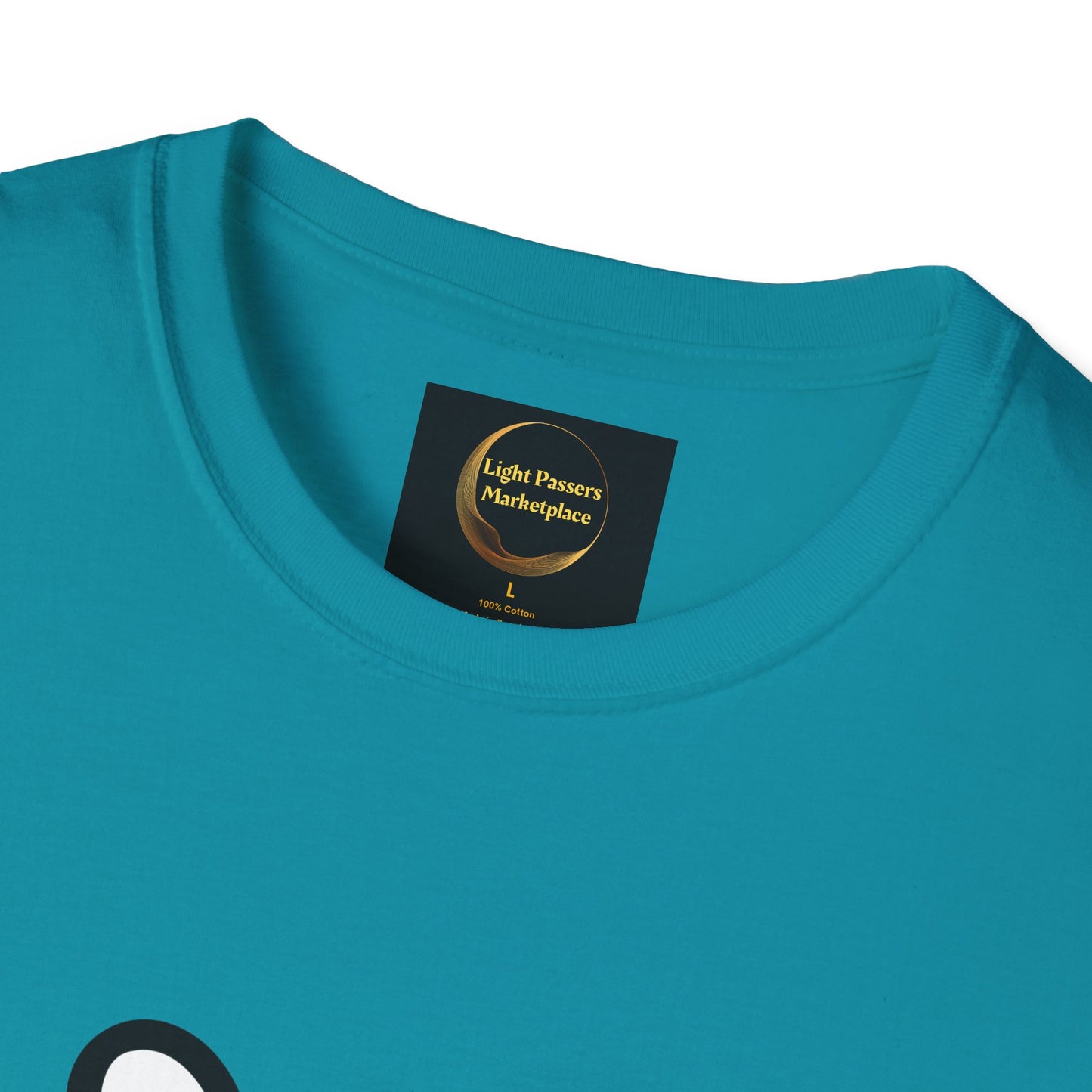Close-up of Soccer Dog Unisex T-Shirt, showing the turquoise neckline with a black label reading “Light Passers Marketplace,” size L, 100% cotton.