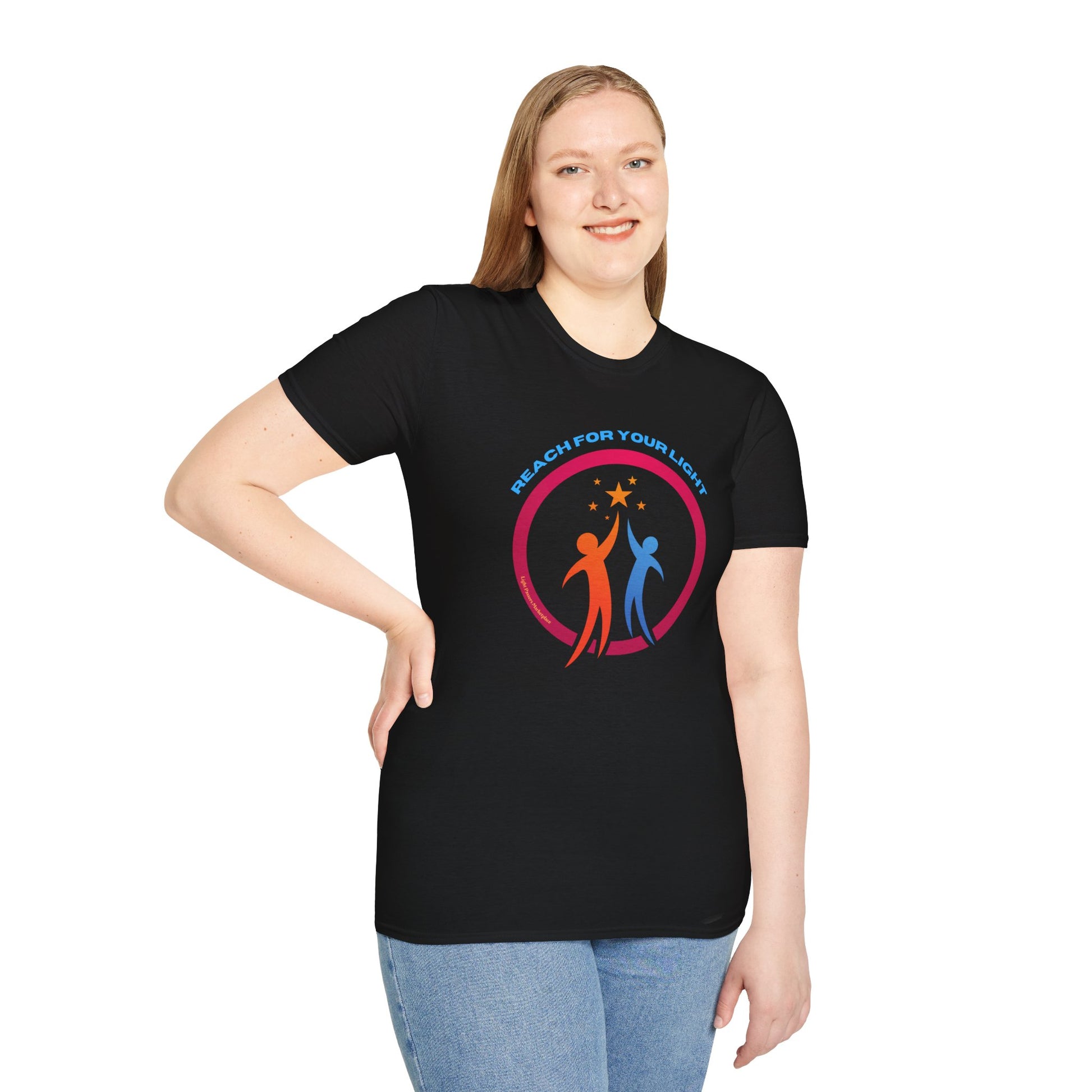 A woman in a black Reach for Your Light unisex t-shirt, showcasing soft 100% cotton fabric, twill tape shoulders, and a clean crew neckline for versatile style.