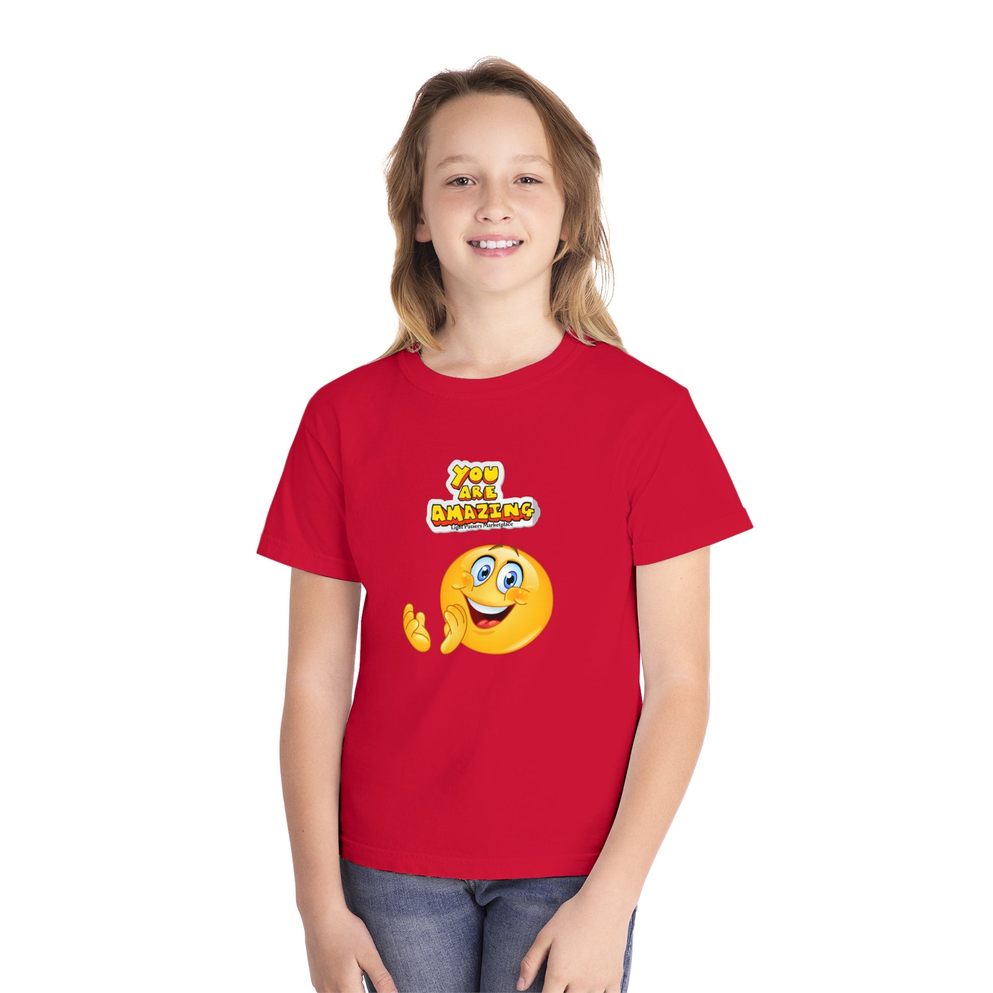 A girl in a red You are Amazing Clap youth t-shirt, made of 100% combed ring-spun cotton for comfort and agility. Classic fit, soft-washed, and garment-dyed.