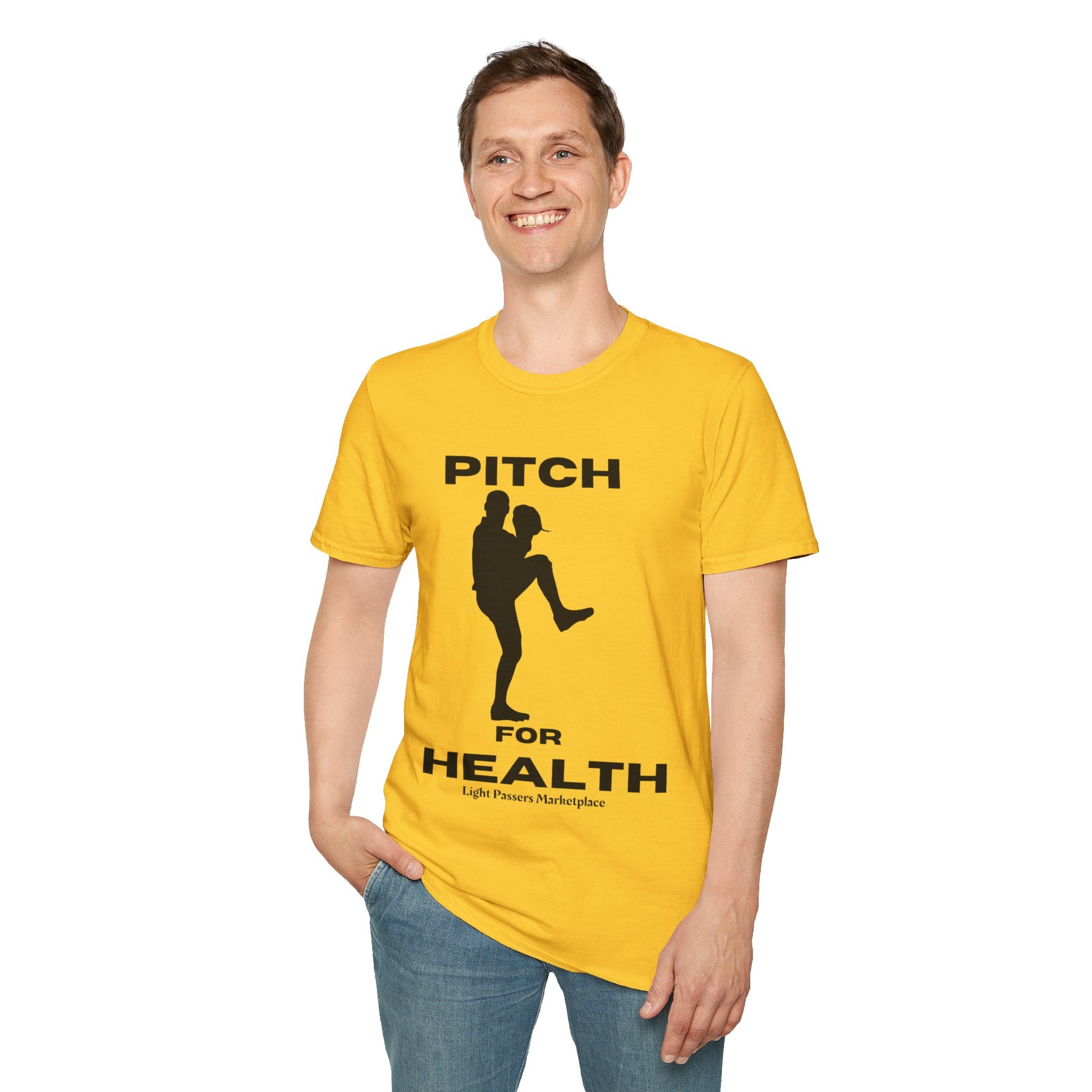 A man in a yellow Pitch for Health unisex t-shirt, smiling, showcasing the soft 100% cotton fabric, twill tape shoulders, and ribbed collar.