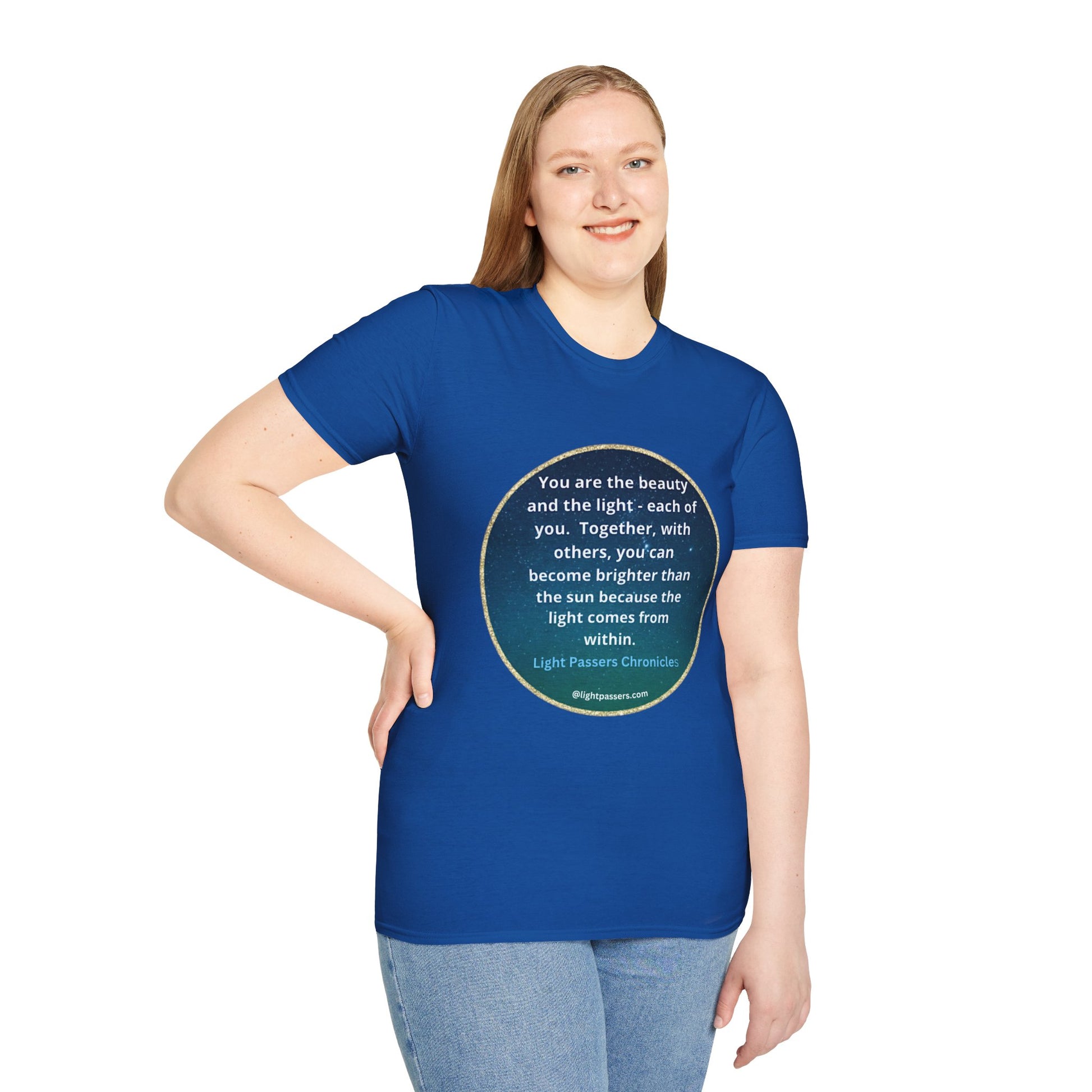 A woman in a blue shirt, smiling, showcasing the Beauty and the Light Unisex T-shirt. Close-up of jeans. Casual, 100% cotton tee with premium printing quality, no side seams, and tape for durability.