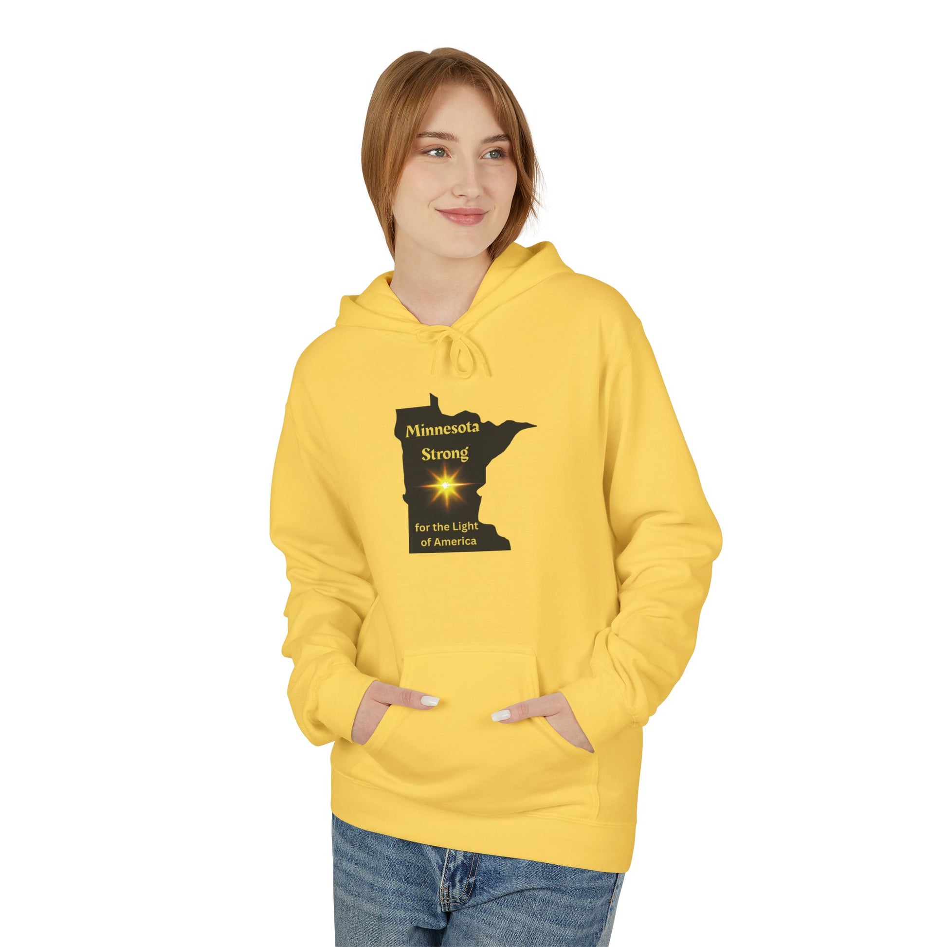 Young person in a yellow Love and Peace The Light hoodie with Minnesota Strong map design, embodying comfort and community spirit.