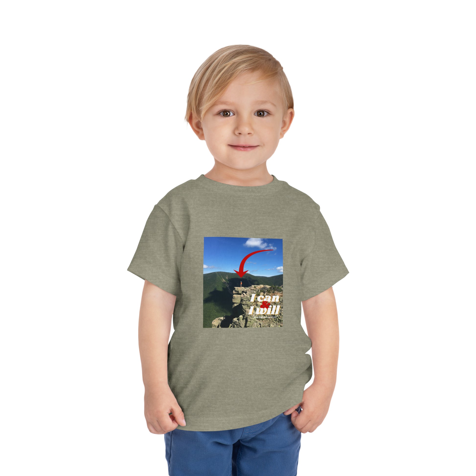 A determined toddler in a custom Bella Canvas tee, featuring I Can and I Will hiking design. 100% Airlume cotton, tear-away label, perfect for everyday wear.