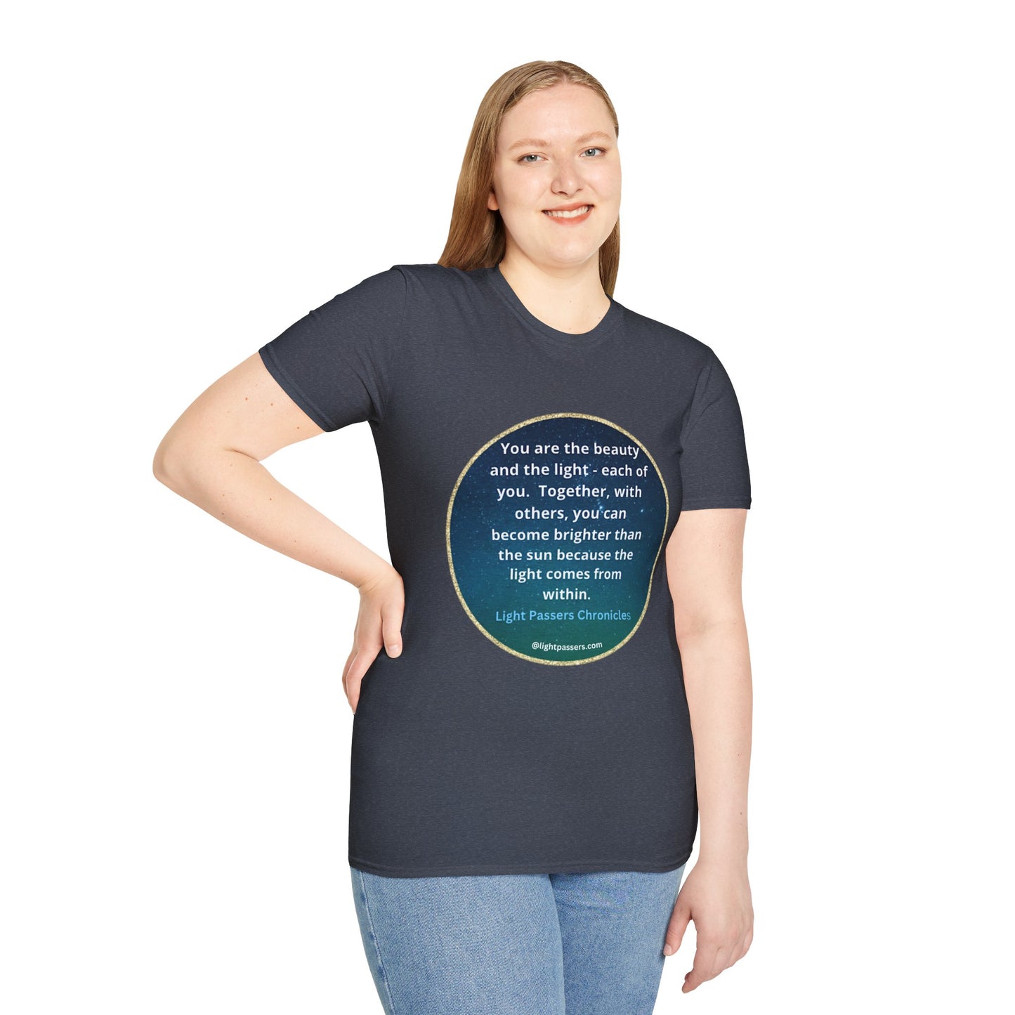 A woman in a blue shirt poses for a picture, showcasing the Beauty and the Light Unisex T-shirt. Close-up of blue jeans and casual attire. 100% cotton, tear-away label, classic fit.