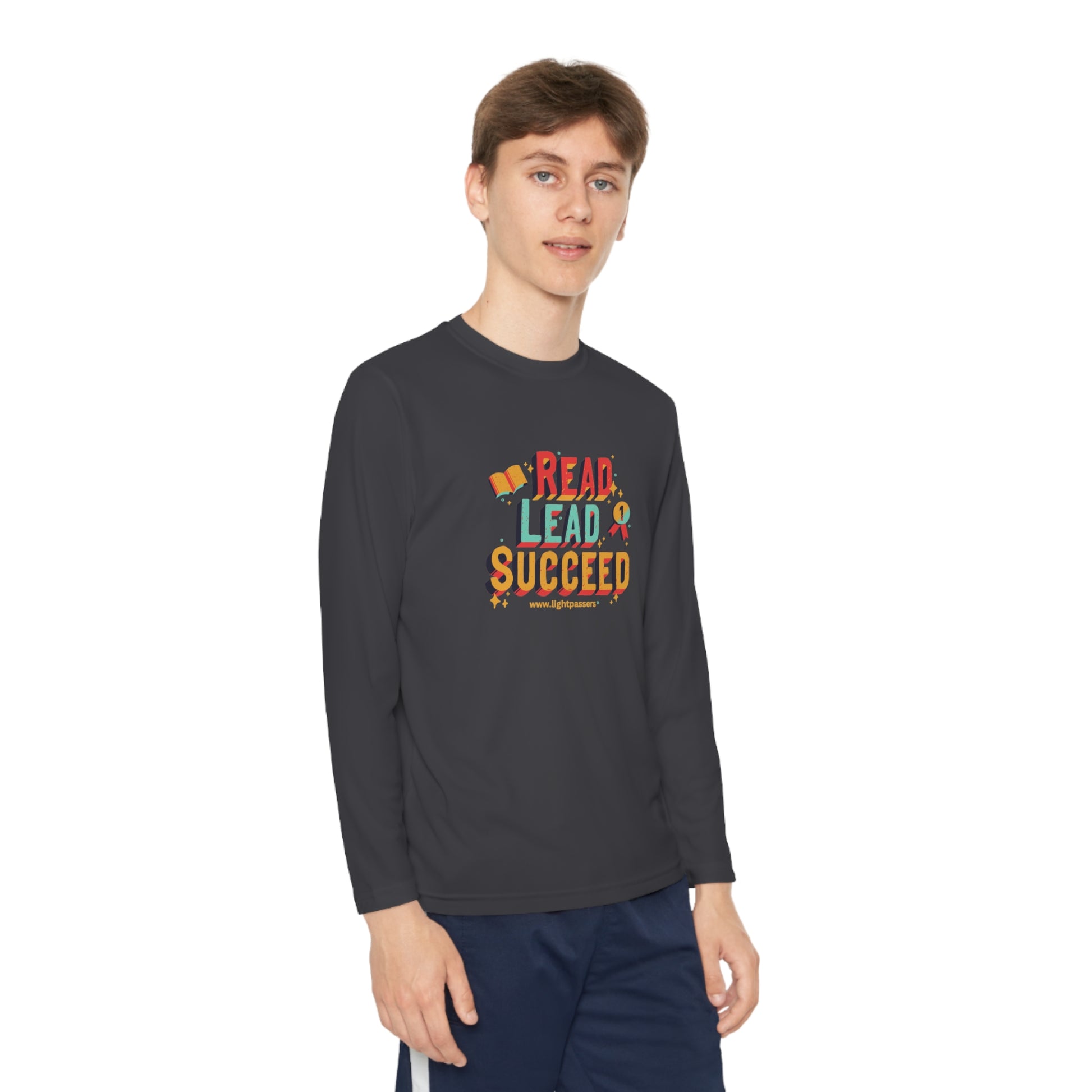 Long Sleeve Read Lead and Succeed Youth T-Shirt, worn by a person, showcasing its athletic fit and long sleeves, ideal for active young readers.