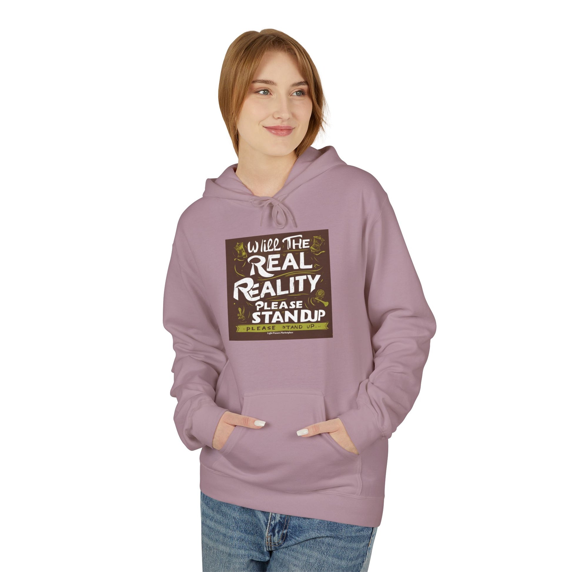 Young woman wearing the Will the Real Reality Please Stand Up hoodie, featuring a square graphic and kangaroo pocket, modeling against a white background.