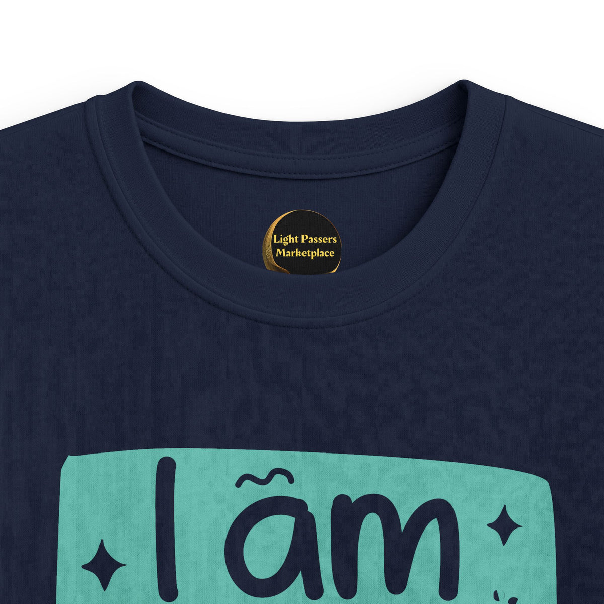 Navy youth graphic T-shirt close-up with 'I am BRAVE' slogan on teal print