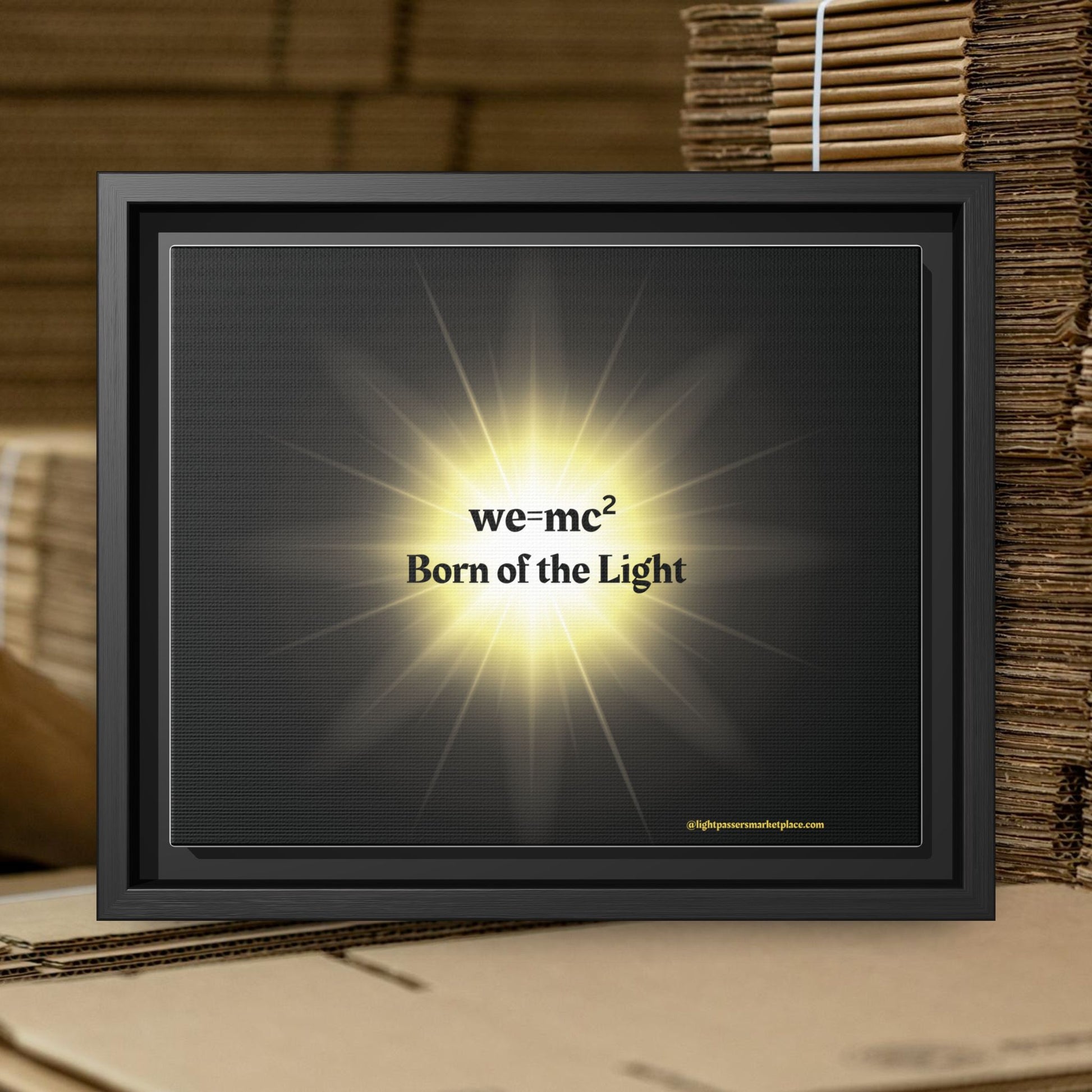 Inspirational Framed Canvas Art - we=mc² Born of the Light, featuring a black frame and radiant display, ideal for uplifting any space.