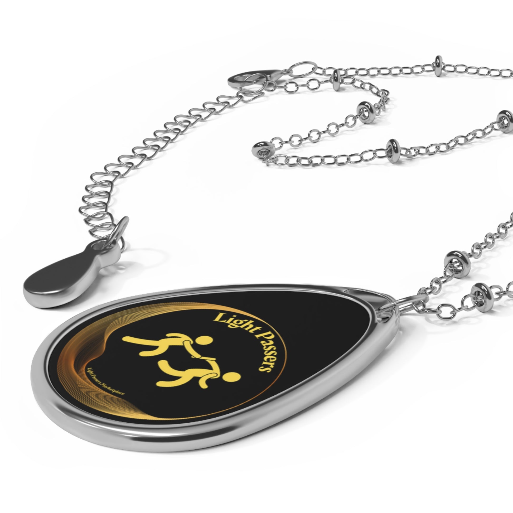 Cool Stuff Accessories Light Passers Relay Logo Necklace featuring a silver chain with an ellipse-shaped black and gold medallion pendant, promoting kindness and hope.