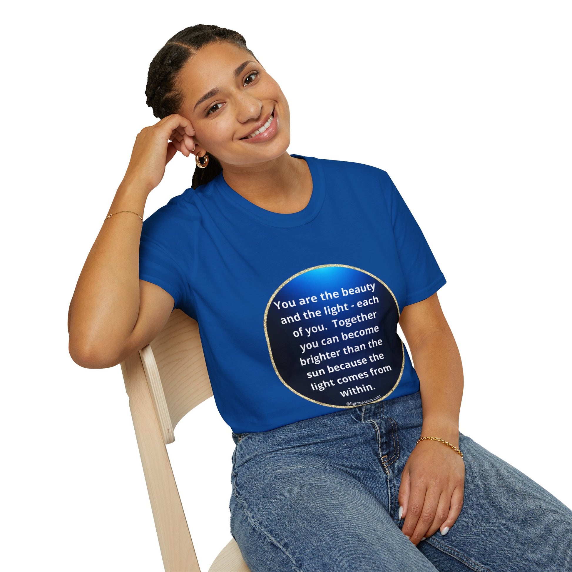 A smiling woman in a blue shirt sits on a chair, showcasing the Beauty Navy Circle Unisex T-shirt. The image captures a casual, comfortable style suitable for everyday wear.