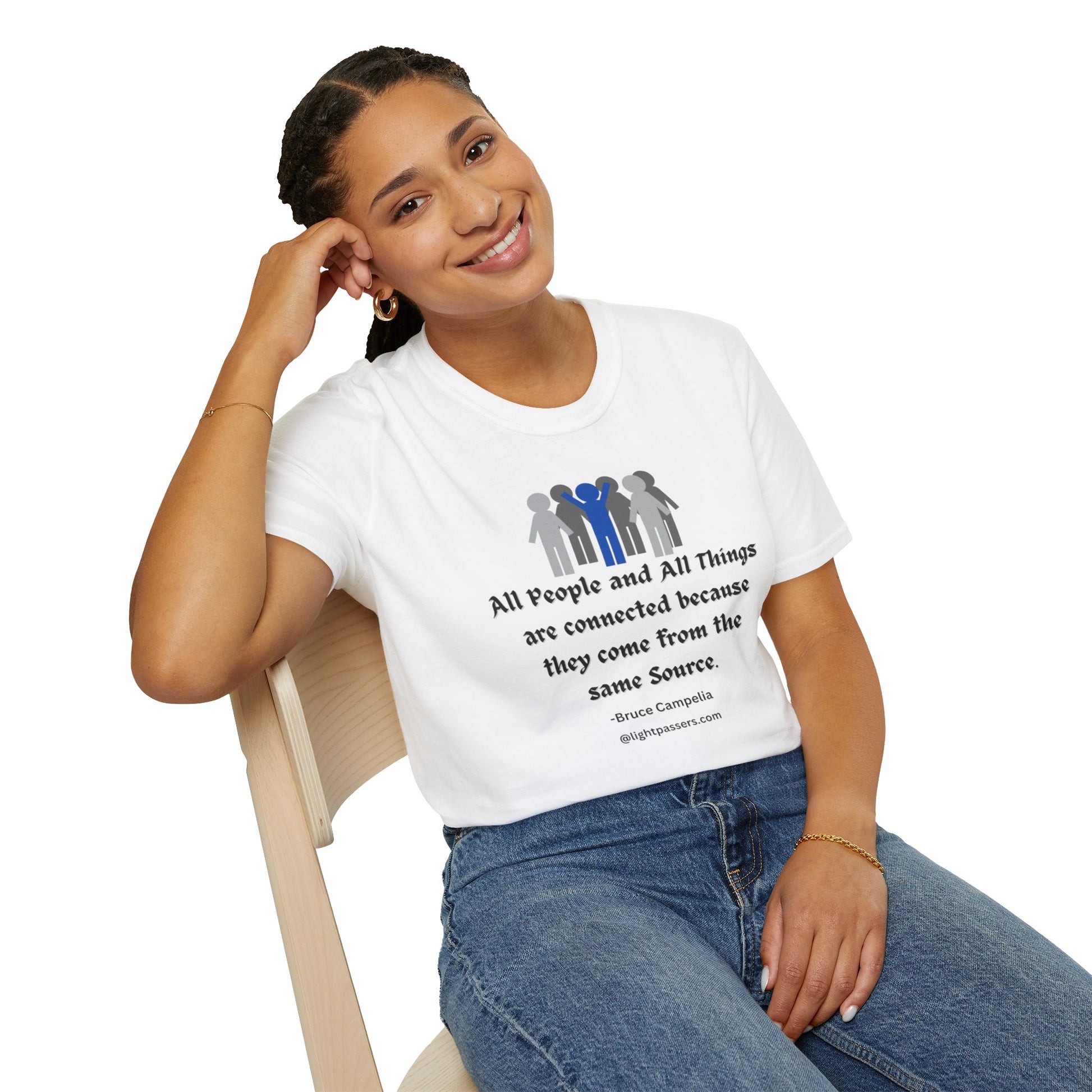 A woman in a white shirt sits on a chair, showcasing the All People are Connected Gray and blue design Unisex T-shirt. The image captures a casual, heavy cotton tee ideal for personalized prints, with a classic fit and durable construction.