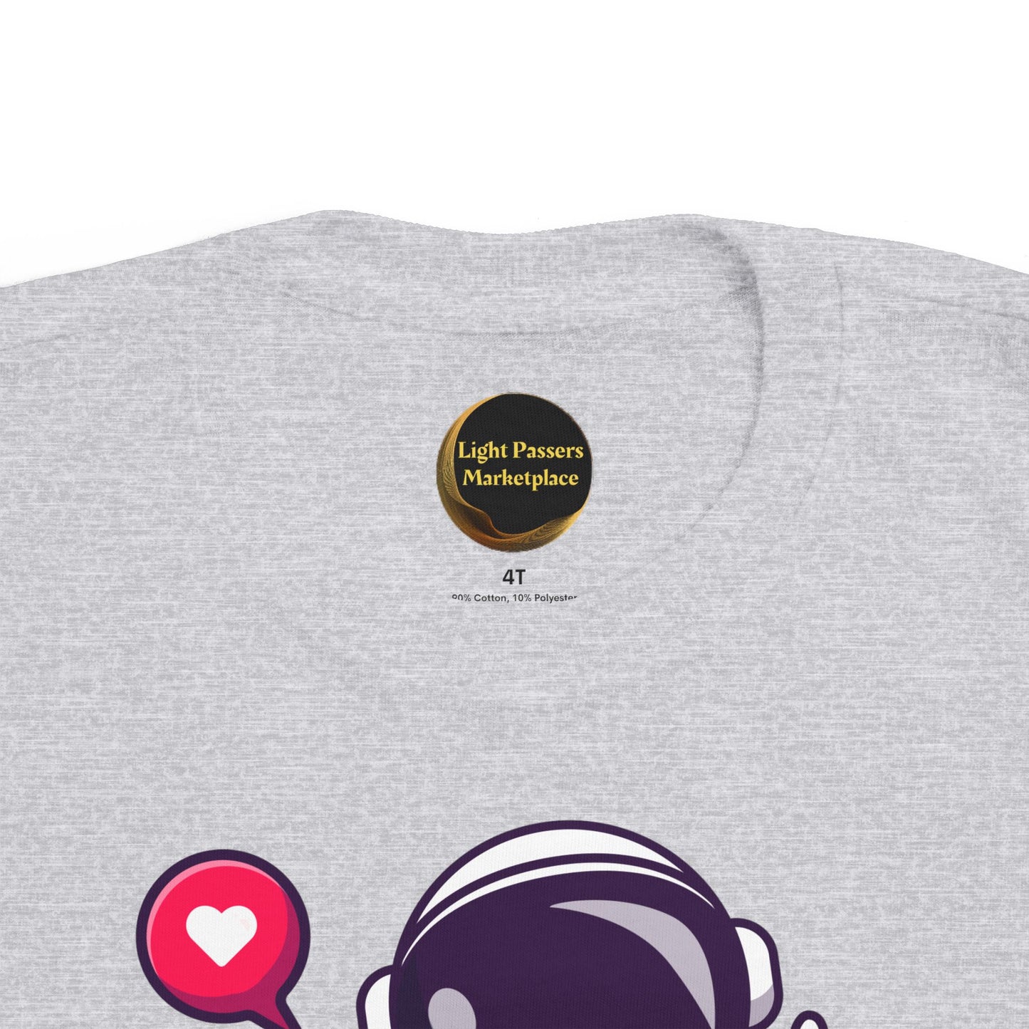 Peace Astronaut Toddler T-shirt in light heather-gray, featuring a “Light Passers Marketplace” badge and a partially visible purple astronaut graphic with a heart chat-bubble icon.