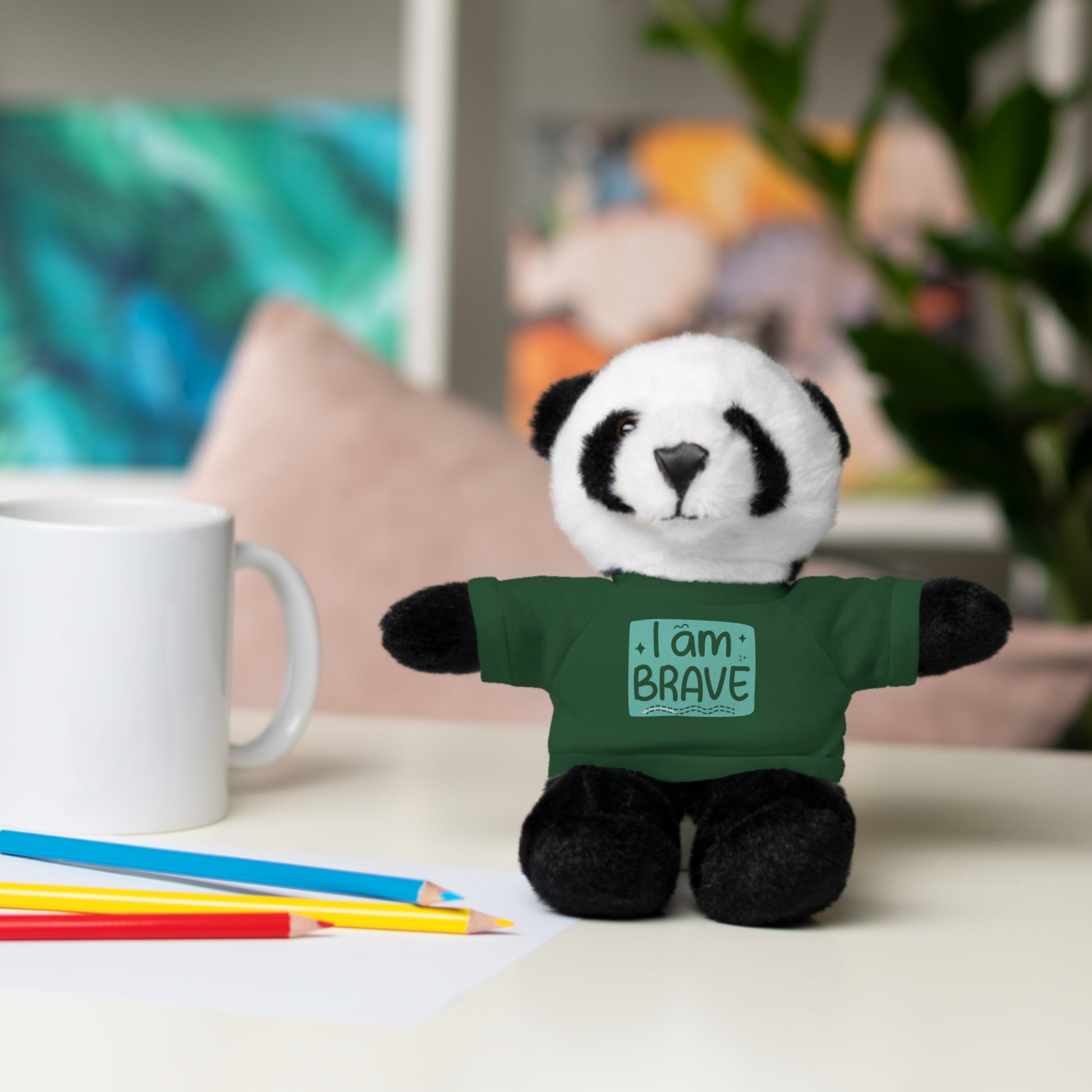 Stuffed panda bear wearing a green I am Brave tee, part of Cool Stuff Stuffies collection, featuring customizable shirts and soft, cuddly design.