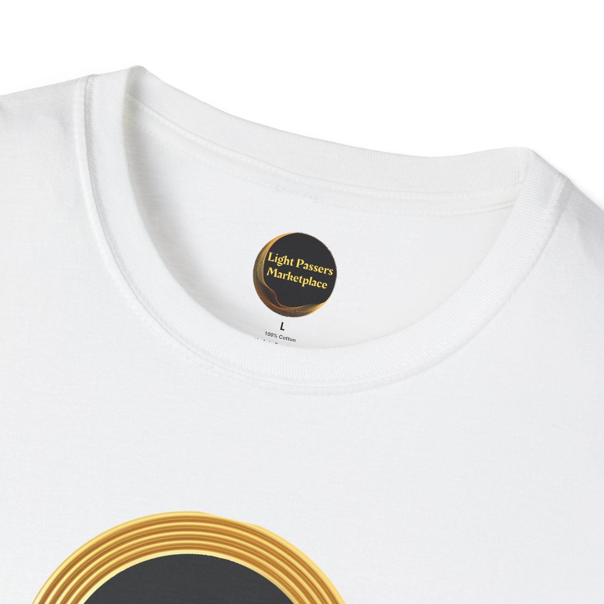 Close-up of the Change Makers Unite white T-shirt neckline, featuring the Light Passers Marketplace label and gold-black circular graphic.