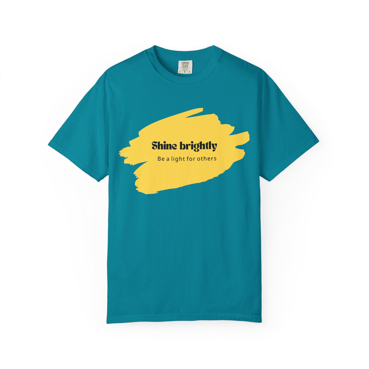 Seafoam unisex T-shirt with yellow paint-splash graphic and “Shine brightly” text