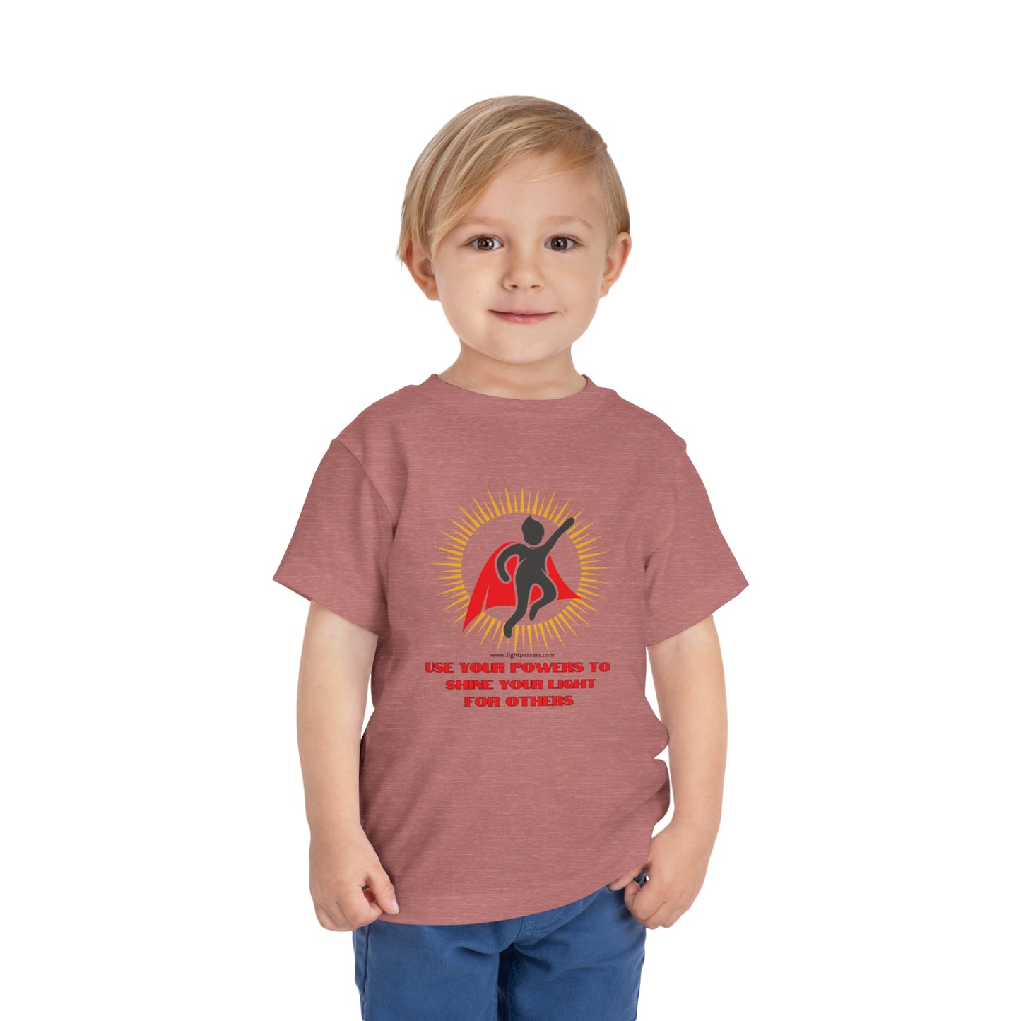 A toddler in a red shirt, close-up on the face, wearing a custom Use Your Powers tee. Bella Canvas cotton blend, tear-away label, perfect for daily wear.