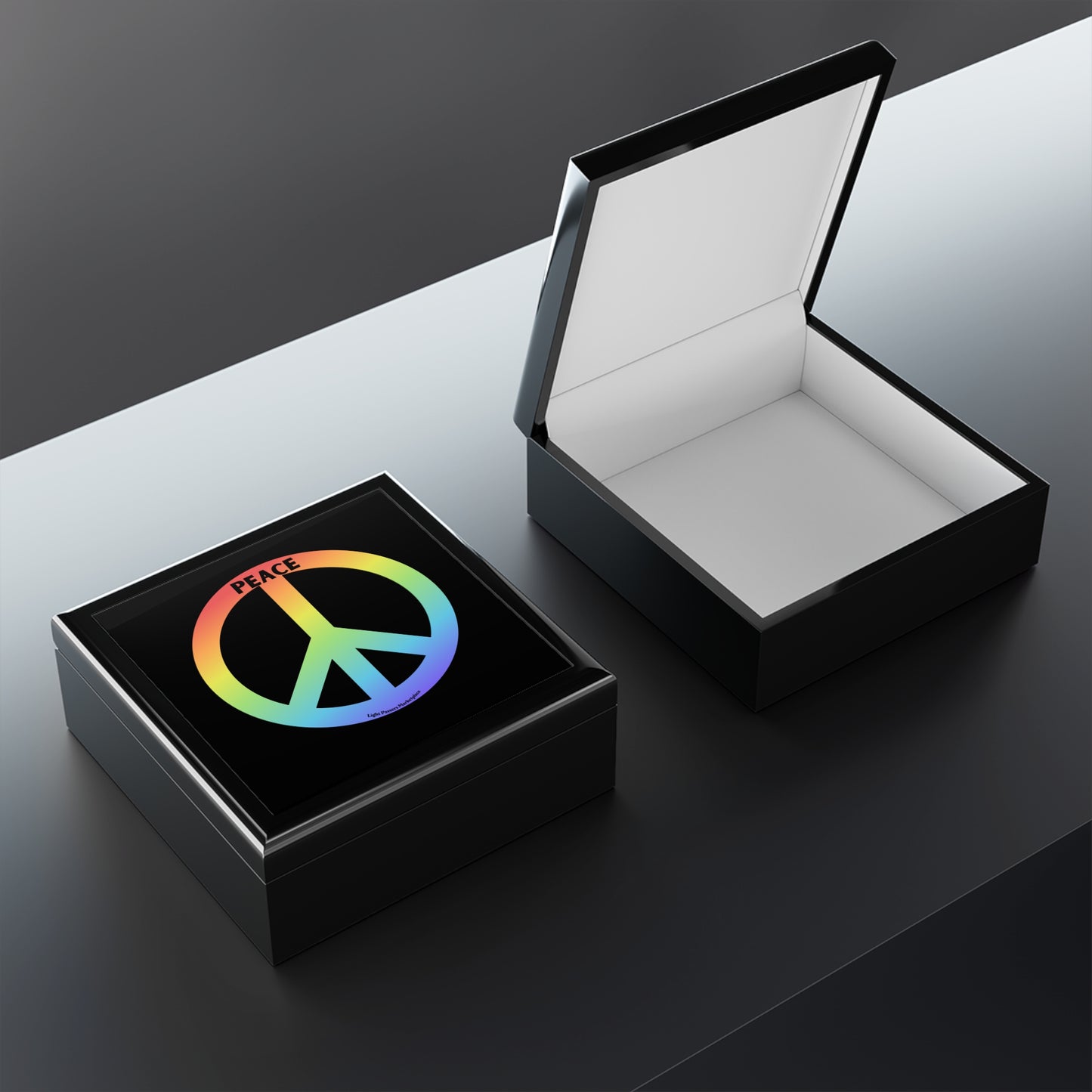 Peace Sign Small Jewelry Box: Two black gift boxes, one open with white interior, one closed showing a colorful peace symbol and PEACE text, on a reflective surface.