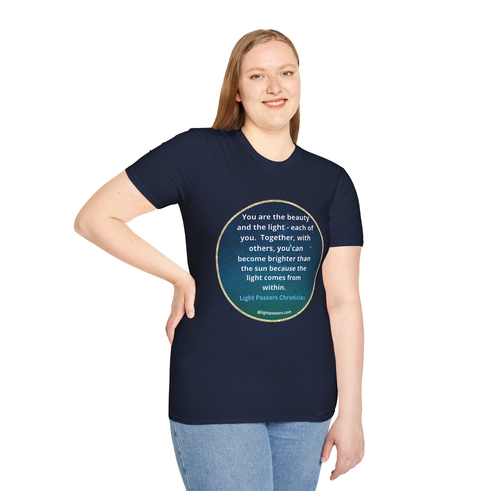 A woman in a blue shirt smiles, showcasing the Beauty and the Light Unisex T-shirt. Close-up of blue jeans. Casual fashion staple with smooth fabric, no side seams, and durable shoulders.