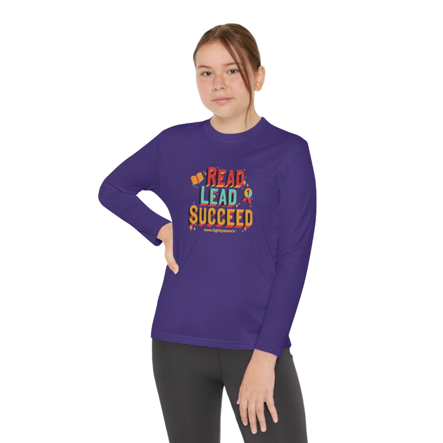 Young girl wearing Long Sleeve Read Lead and Succeed Youth T-Shirt, showcasing its athletic fit and moisture-wicking material, ideal for active students.