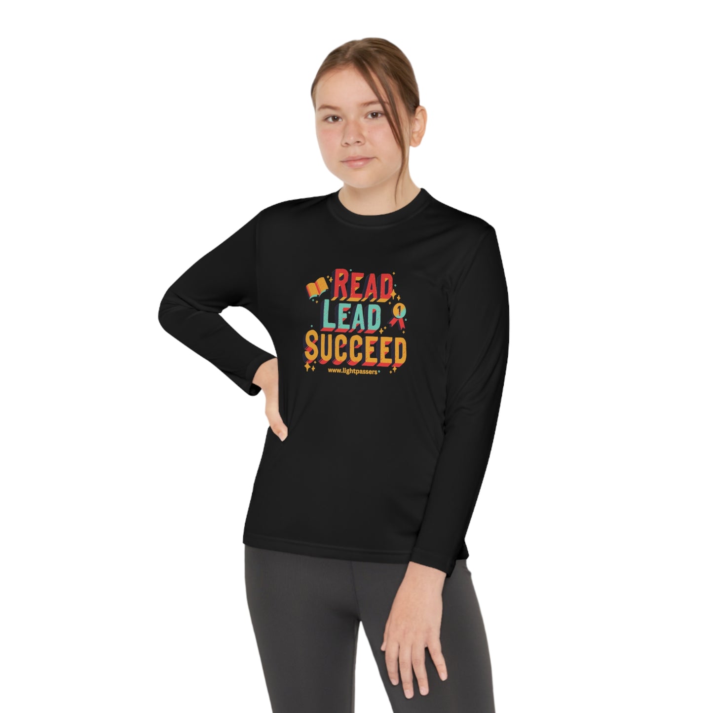 Long Sleeve Read Lead and Succeed Youth T-Shirt, worn by a young model, showcases its athletic fit and moisture-wicking fabric, perfect for active students.