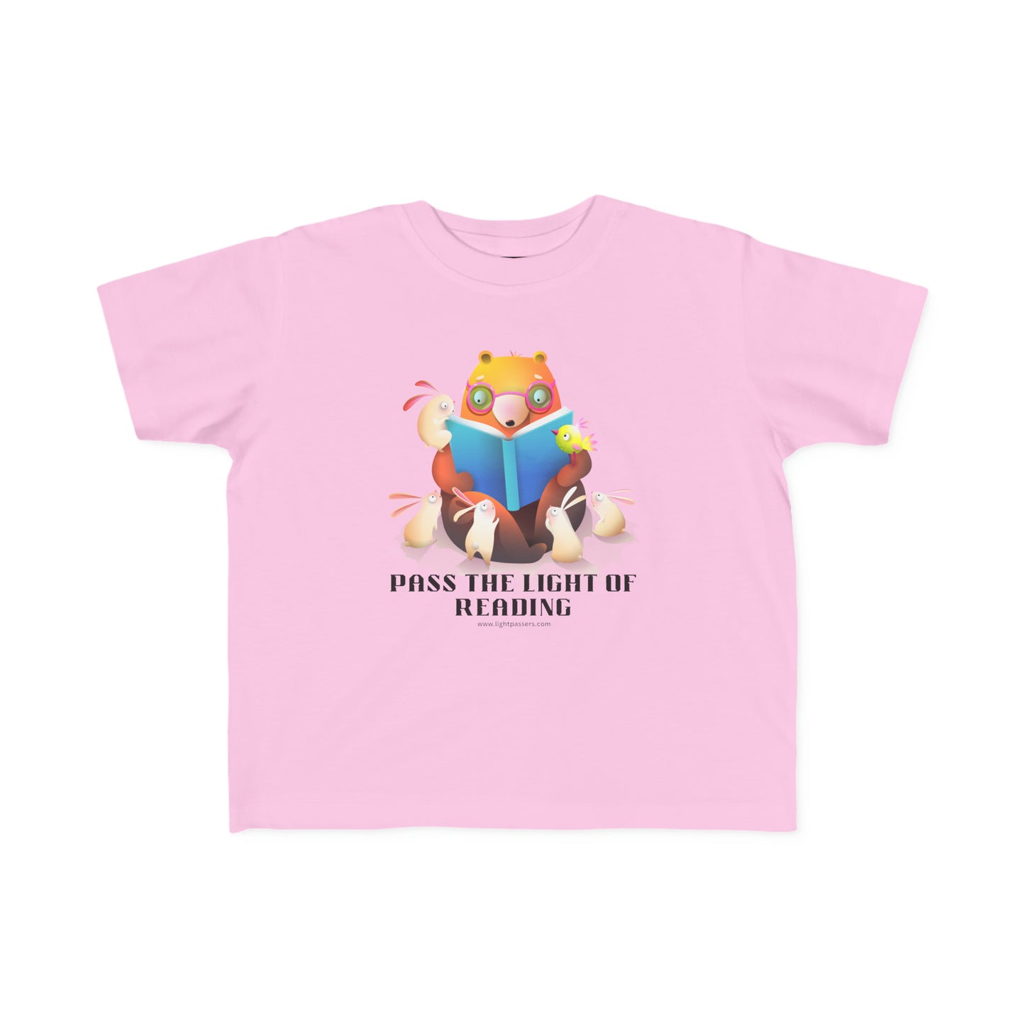 A toddler's tee featuring a cartoon bear reading a book, ideal for sensitive skin. Made of 100% combed cotton, light fabric, and a tear-away label.