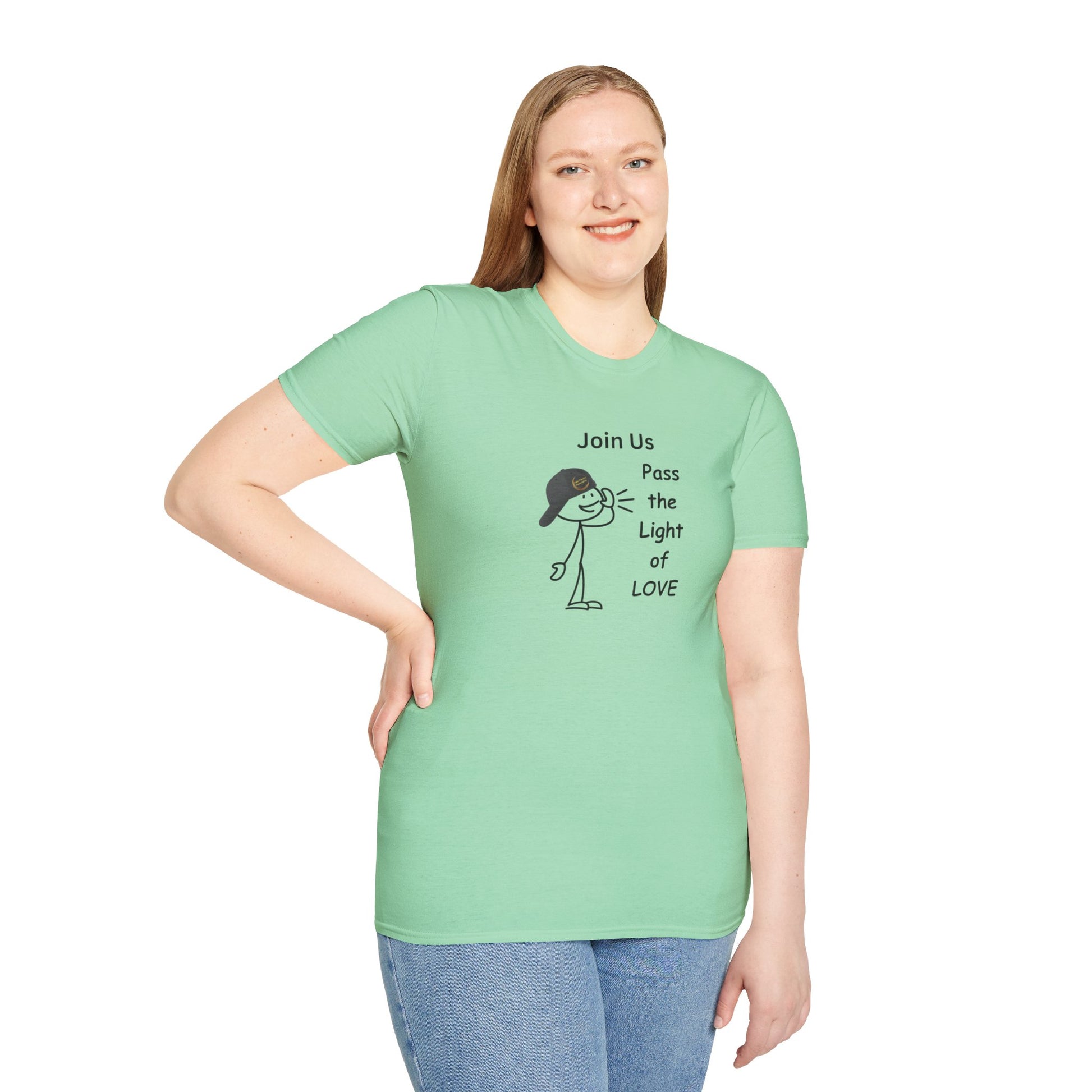 A woman in a green shirt poses for a picture, showcasing the Join Us Pass the Light of Love Unisex T-shirt. Classic fit, 100% cotton tee with no side seams for comfort.