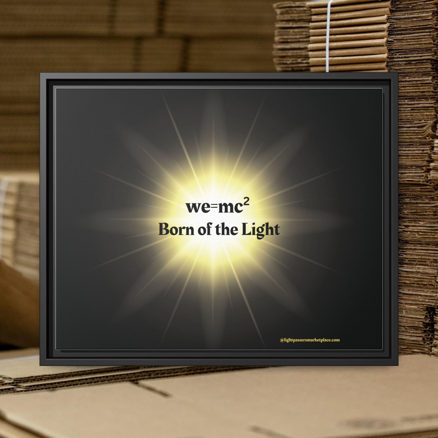 Inspirational Framed Canvas Art - we=mc² Born of the Light, featuring a black frame with a radiant yellow light, enhancing any space with motivating art.
