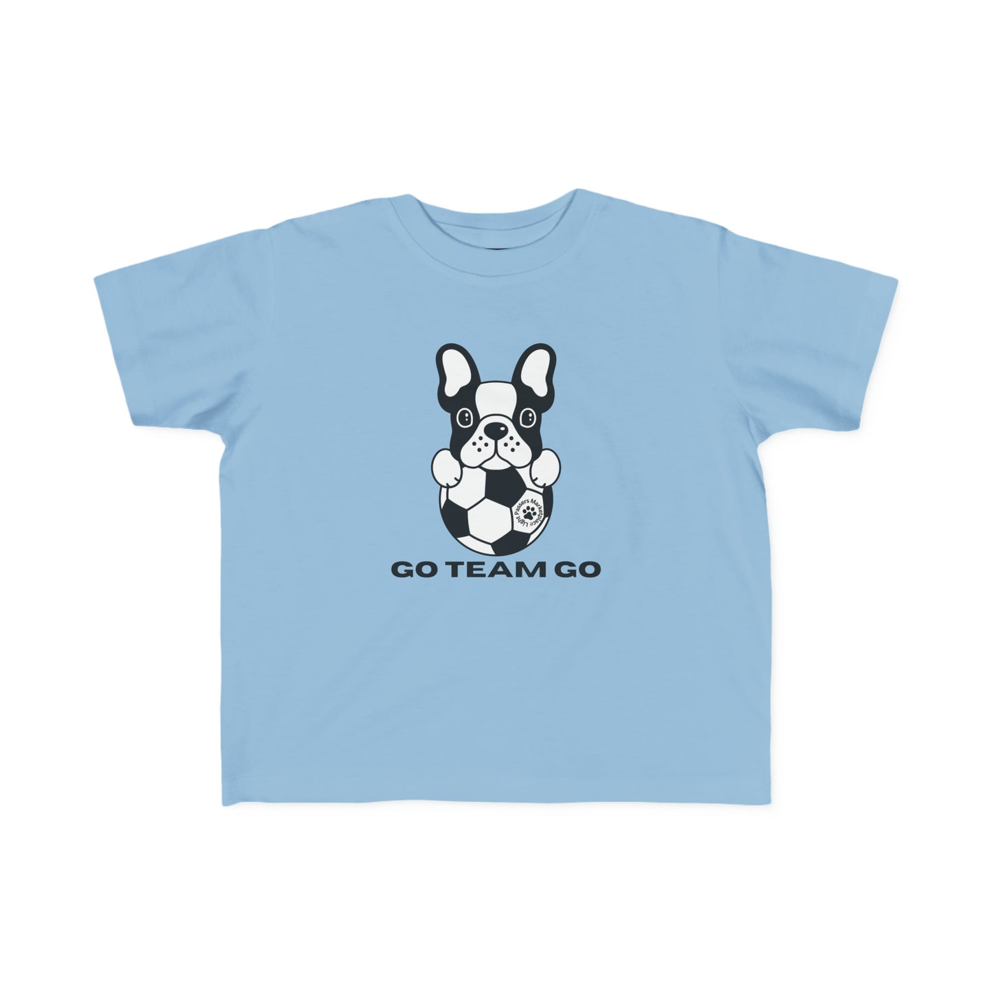 A toddler tee featuring a dog playing soccer, ideal for sensitive skin. Made of 100% combed cotton, light fabric, and a tear-away label. Classic fit, durable print, perfect for little adventurers.