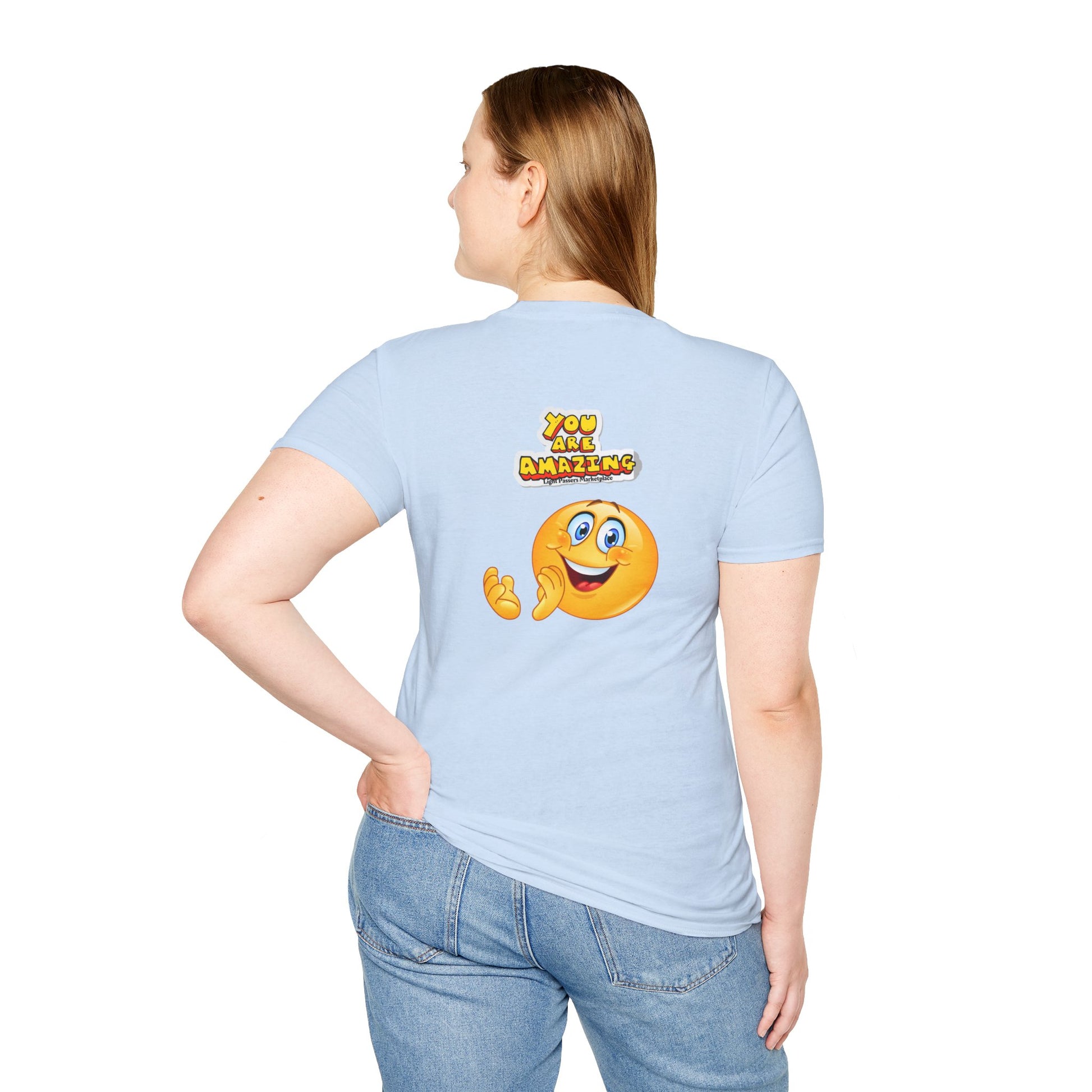 A unisex soft-style t-shirt featuring a smiley face design on a person's shoulder, made of 100% ring-spun cotton for comfort and durability. No side seams, ribbed collar, and tear-away label for total wearing comfort.