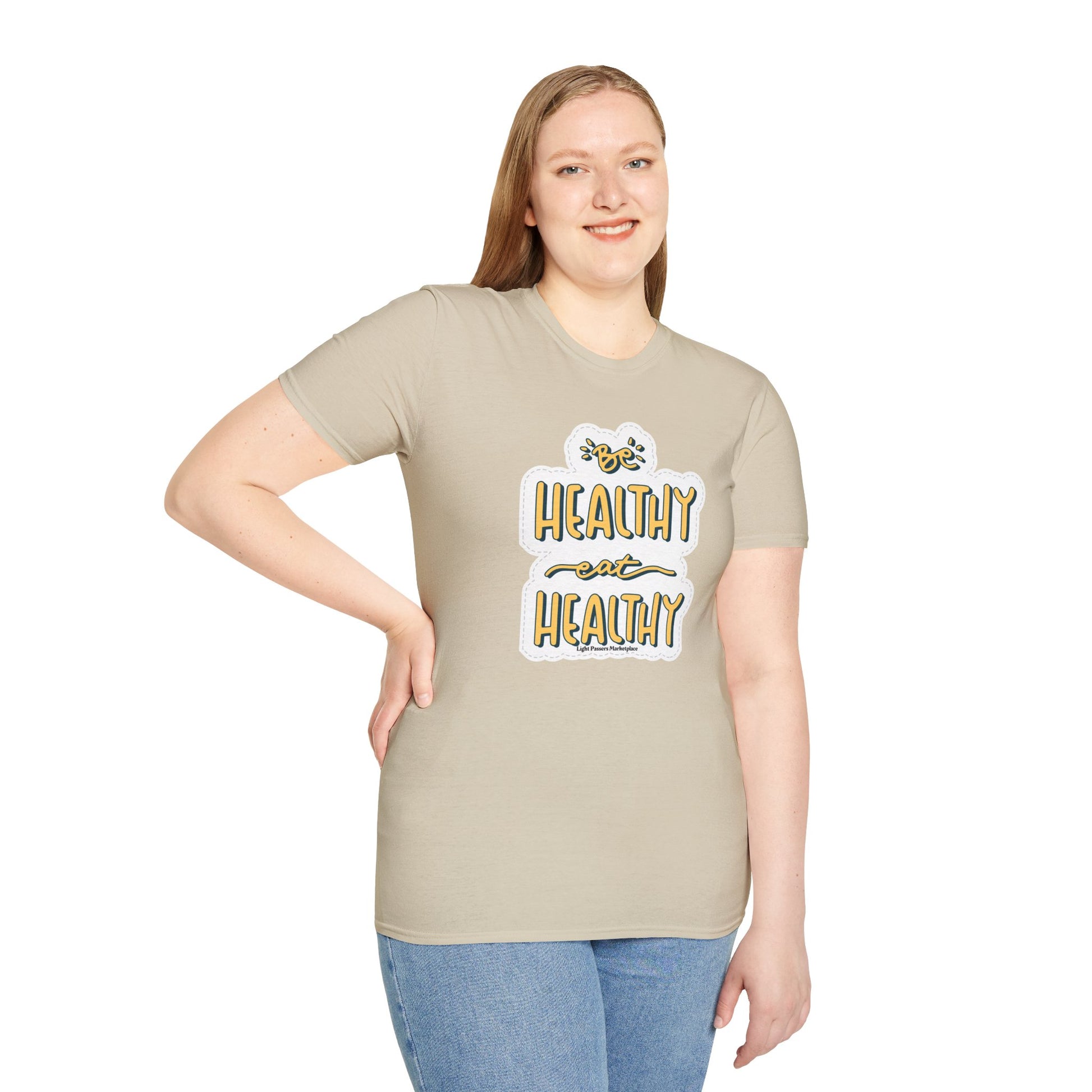 A woman in a Be Healthy Eat Healthy Unisex T-Shirt, showcasing its soft cotton fabric, twill tape shoulders, and ribbed collar for comfort and durability.