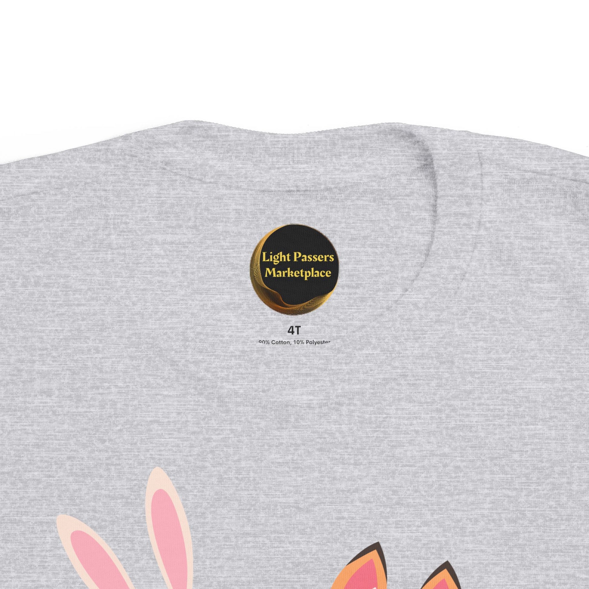 Light gray toddler tee, size 4T, from Light Passers Marketplace, features inside-neck label, fabric details, and partially visible pink and orange animal ears graphic.