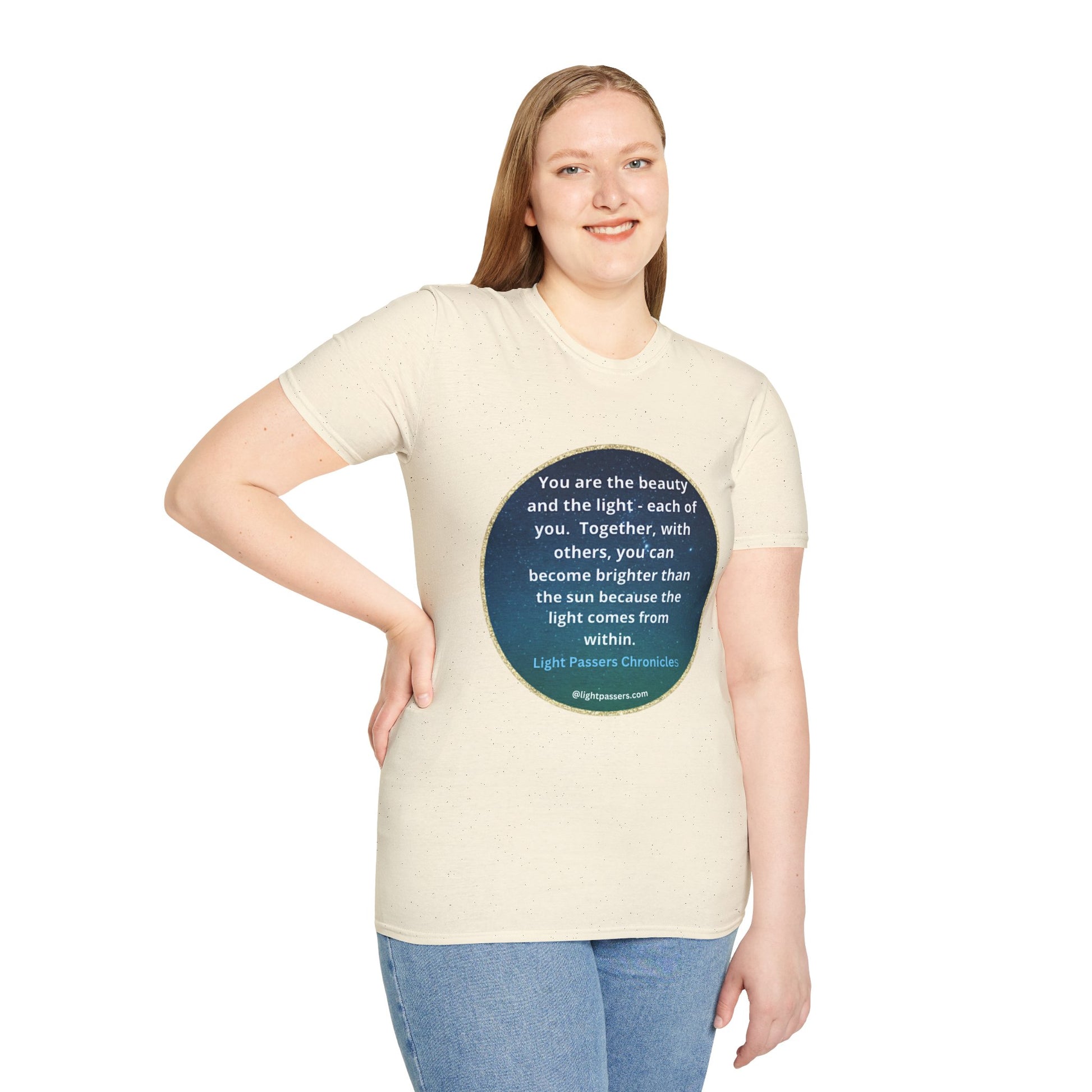 A woman smiles, wearing the Beauty and the Light Unisex T-shirt, featuring a blue circle design. Close-up of blue jeans. Casual fashion staple. Cotton tee with smooth surface for vivid printing.