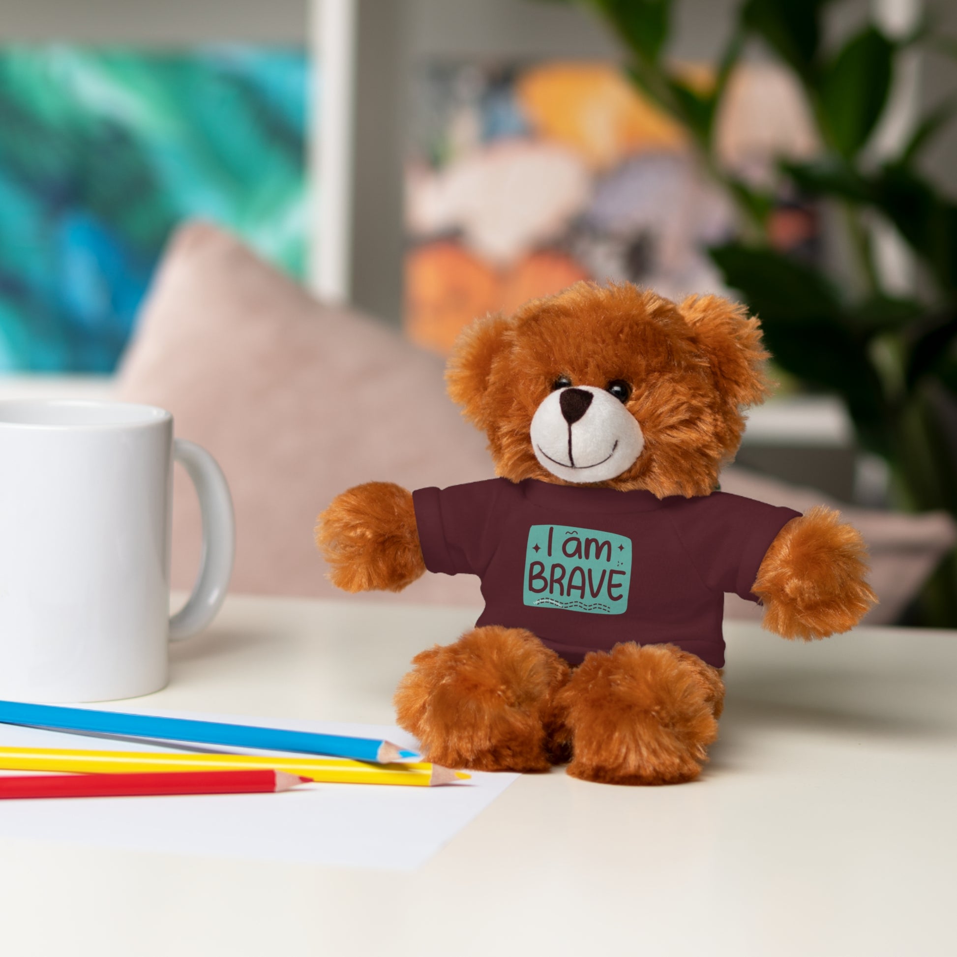 Teddy bear wearing a customizable shirt with I am Brave message, part of Cool Stuff Stuffies collection, featuring six plush animal designs.