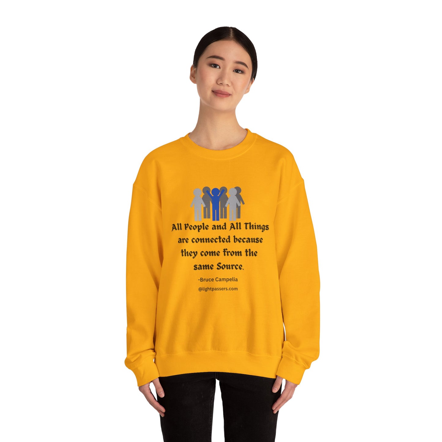 A person in a yellow sweatshirt with a quote, showcasing a cozy unisex crewneck sweatshirt made of 50% cotton and 50% polyester blend for comfort and durability.