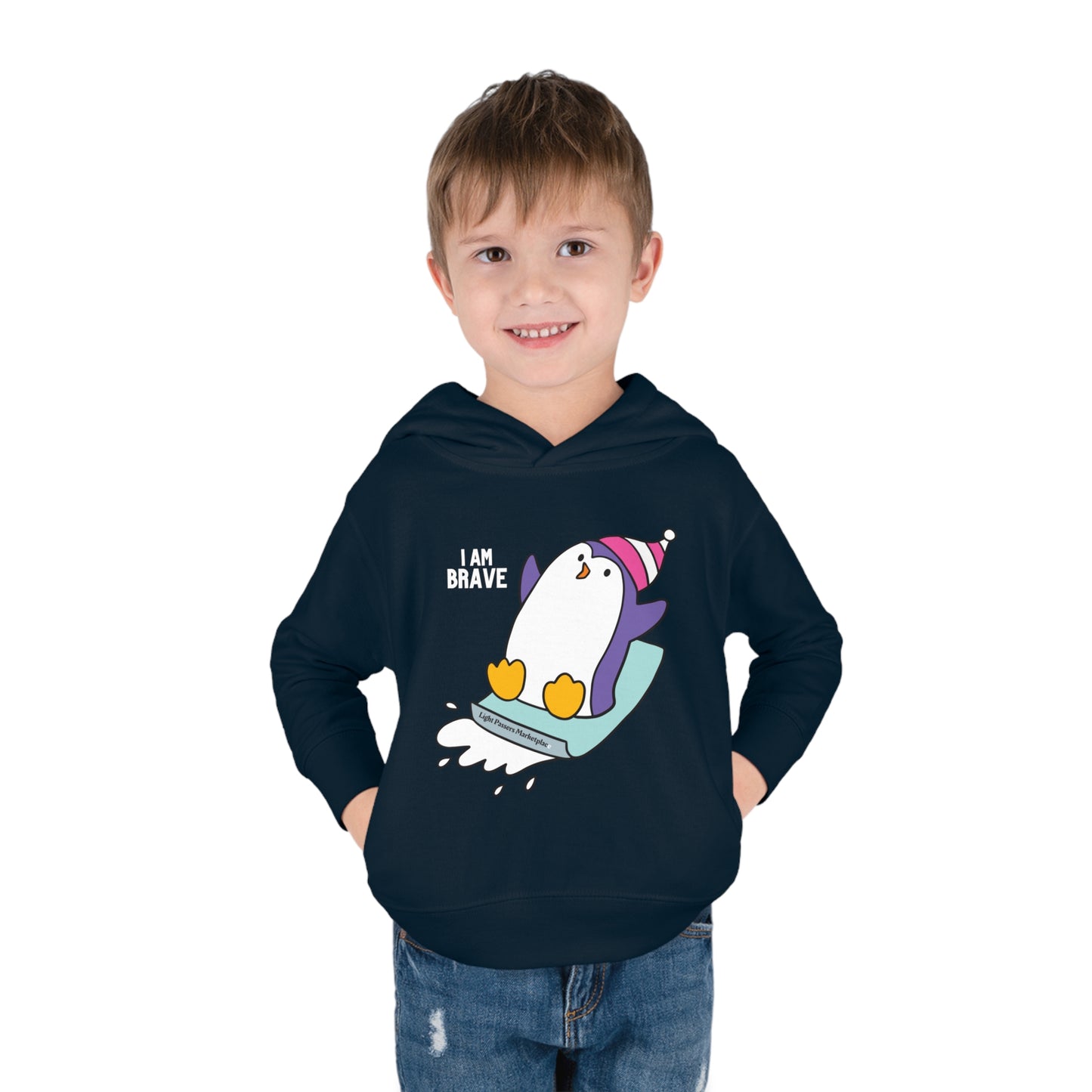 A toddler in a Brave Penguin hoodie with side seam pockets, jersey-lined hood, and cover-stitched details for durability and comfort.