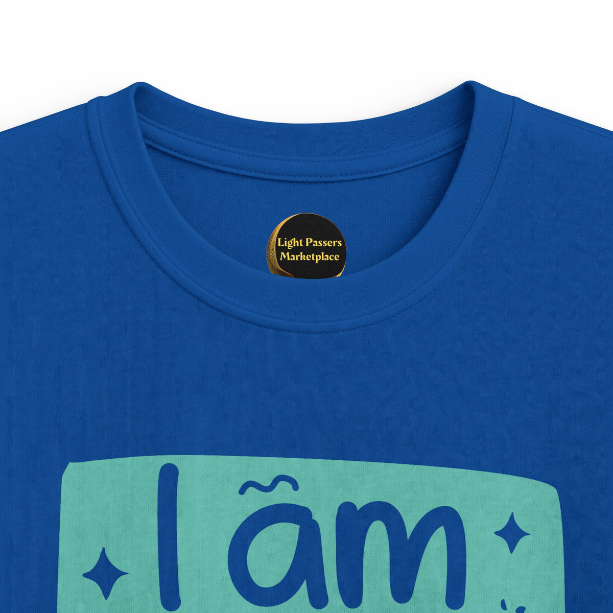 Royal blue youth graphic T-shirt close-up with 'I am BRAVE' slogan on teal print
