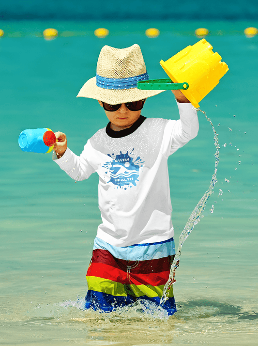 A boy in a sun hat and sunglasses plays with water, holding a toy bucket. Swim for Health Toddler Long Sleeve T-shirt, 100% cotton, durable, with ribbed collar.