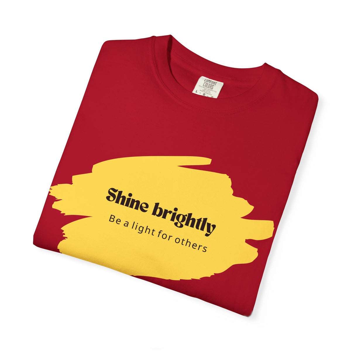 Red unisex T-shirt with yellow “Shine brightly” graphic and crew neck.