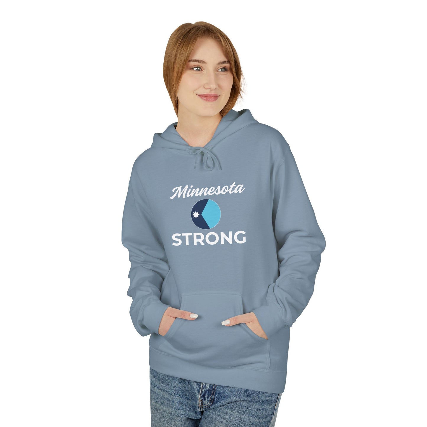 Model wearing the Love and Peace The Light Adult Minnesota Strong Hoodie with a circular Minnesota logo and STRONG text, hands in kangaroo pocket.